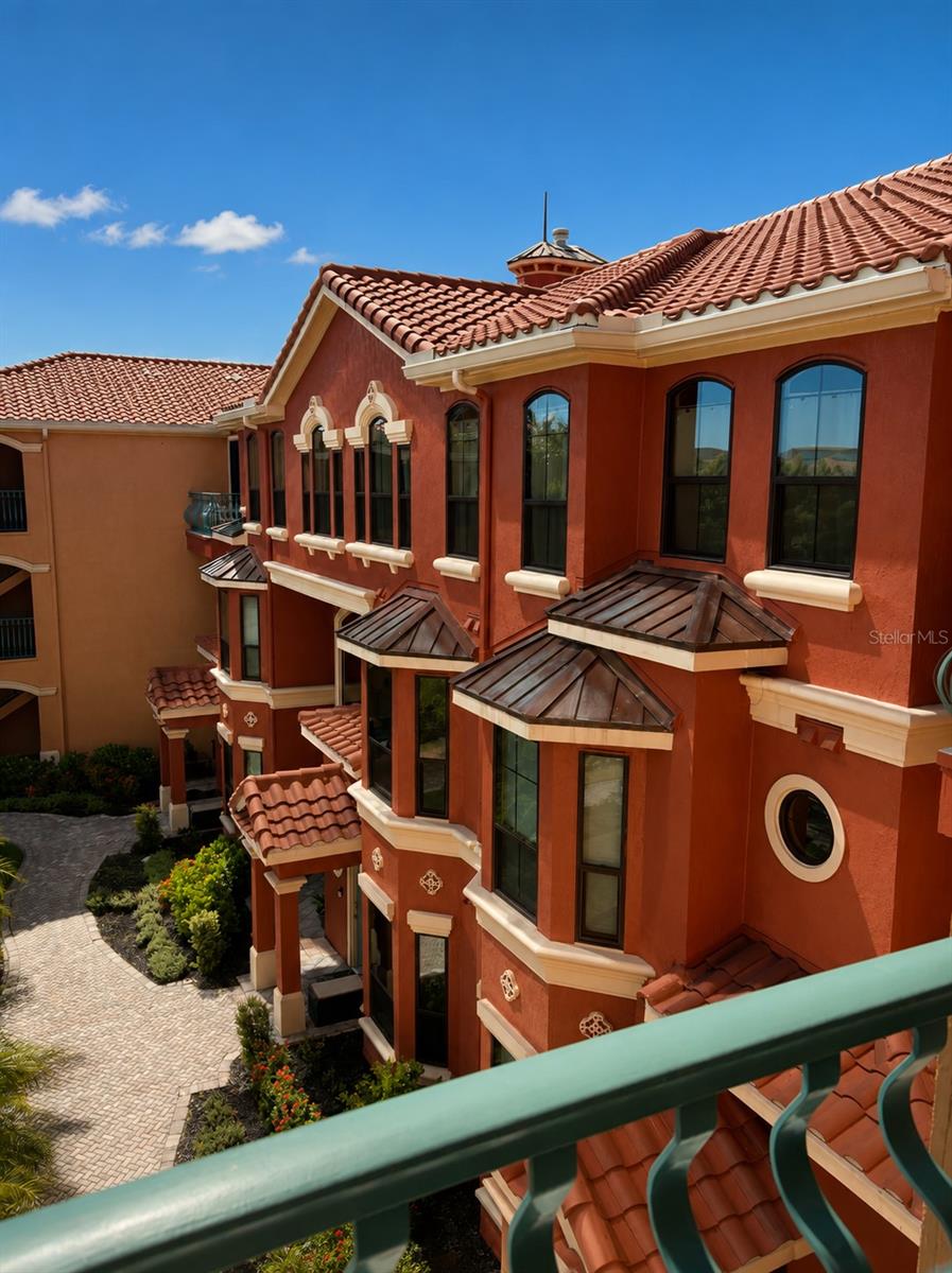 Come home to resort-style living in the exquisite Grand Bellagio at Baywatch community! You are greeted with elegance and sophistication from the moment you enter the property with the Italian stone fountains that anchor the entryway of the 24-hour security gate. As you explore your new community, you'll find sensational tropical landscaping and wrought-iron accents. The beautifully maintained 2-bedroom, 2-bathroom condominium offers a comfortable living space with high ceilings featuring gorgeous crown molding. This unit's highly desirable split floor plan offers two nearly identical bedrooms that each boast owner suite potential. These two spacious bedrooms with en-suite bathrooms each feature double vanities for added convenience. Inside, you'll find elegant plantation shutters throughout accompanying stunning arched windows. The open-concept living and dining areas create a welcoming atmosphere perfect for entertaining or relaxing at home. Enjoy added peace of mind with updates, including a new A/C installed in 2021, a new roof completed in 2023, and new kitchen floors completed in 2026. Take advantage of the exceptional array of amenities, including a heated pool, clubhouse, 24-hour fitness center, marina with boat slips, and a scenic 1.5-mile waterfront walking trail. Conveniently located near Clearwater's shopping, dining, airports, and award-winning Gulf beaches, this property offers the perfect combination of elegance, comfort, and convenience. Whether you're looking for a primary residence, seasonal getaway, or investment opportunity, this move-in-ready home delivers the Florida lifestyle you've been searching for with the beauty and sophistication of Italian garden-style living.