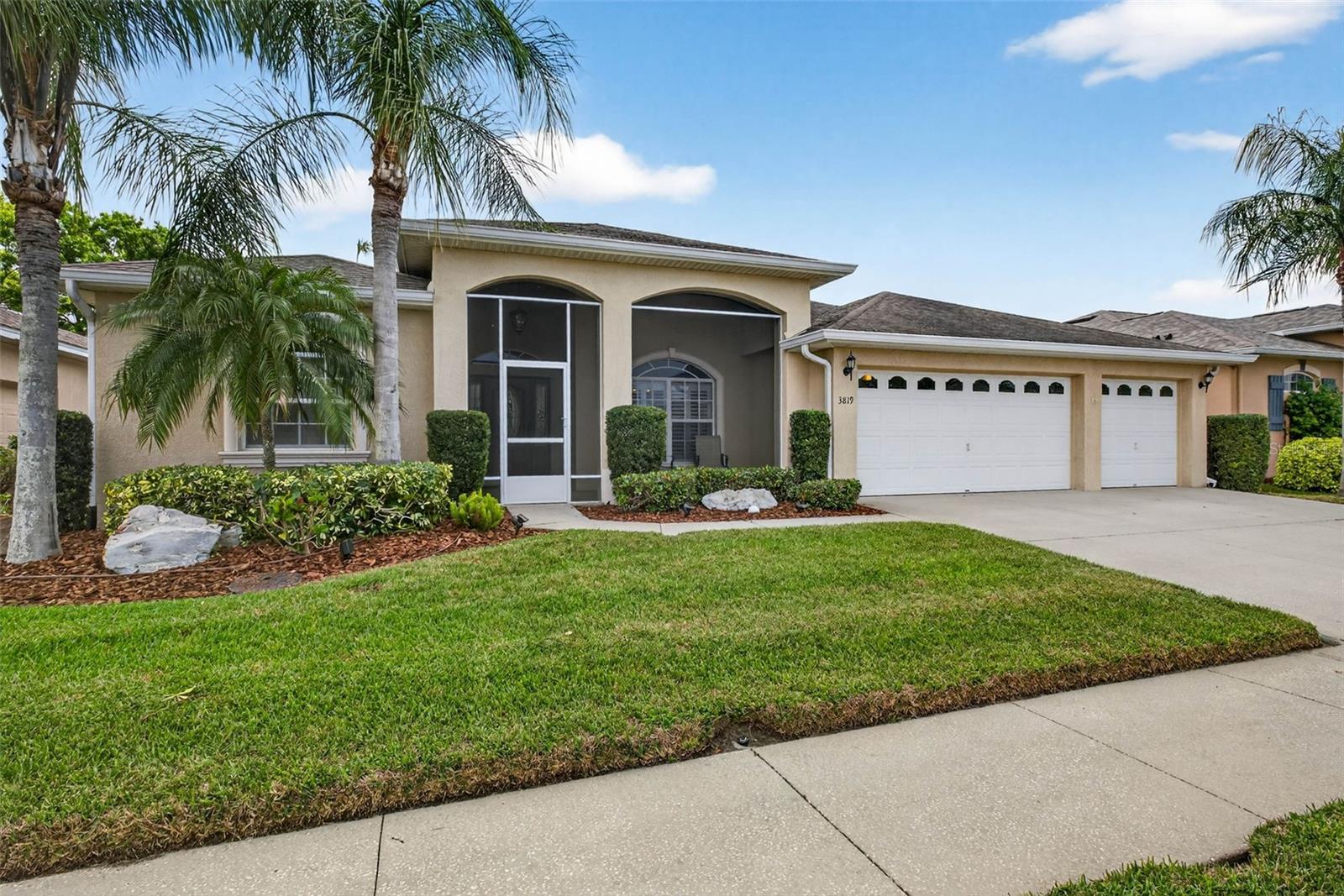 Imagine pulling into a quiet, gated community and instantly feeling like you’ve arrived somewhere special. This 4 bedroom, 3 bath, 3 car garage with a new roof (2026) has the lush landscaping and welcoming front porch set the tone—but it’s what’s inside (and out back) that truly makes this home unforgettable. As you step through the front door, your eyes are immediately drawn past the bright, open living space to the screened lanai and your own private resort-style pool and spa. With sliding glass pocket doors, the indoor and outdoor spaces blend seamlessly—perfect for entertaining friends or simply enjoying a peaceful Florida evening. The kitchen feels both elegant and comfortable, with rich 42” cherry wood cabinetry, granite countertops, stainless steel appliances, and a cozy breakfast nook where mornings feel easy and relaxed. A separate dining room offers the perfect space for hosting holidays or dinner parties. The primary suite is a true retreat—spacious, light-filled, and thoughtfully designed with cathedral ceilings, dual custom walk-in closets, and direct access to the pool. The ensuite bath offers a spa-like experience with a soaking tub, walk-in shower, and dual vanities. With a split floor plan, three additional bedrooms and two full baths provide flexibility for guests, family, or even a home office setup. Set along the 3rd green of Cypress Creek Golf Course, this home offers beautiful views and a sense of privacy, all within the desirable Villa D’ Este community—featuring low HOA fees, no CDD, and a community pool. And when you do venture out, you’re perfectly positioned between Tampa and Sarasota, with easy access to beaches, dining, shopping, entertainment, and even Orlando just a day trip! If you’ve been dreaming of a home where every day feels like a getaway… this might just be the one.