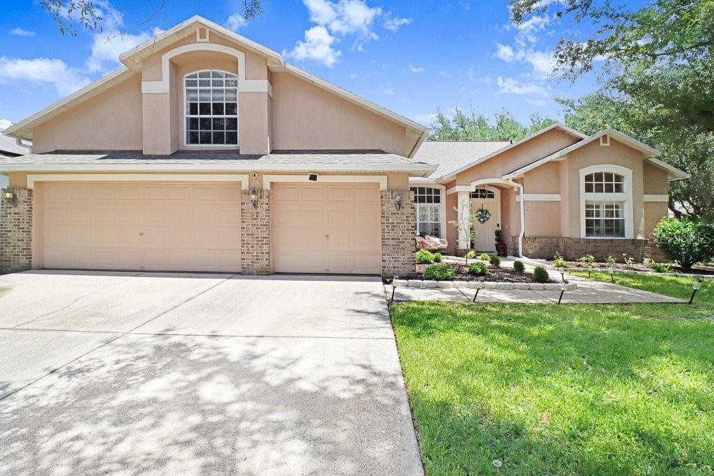 Experience refined Florida living in this beautifully reimagined 4-bedroom, 3-bath residence with a spacious loft and 3-car garage, offering 2,873 square feet of thoughtfully designed living space.

From the moment you arrive, you'll appreciate the home's impressive list of recent enhancements, including a brand-new roof, stunning remodeled kitchen, beautifully updated bathrooms, new luxury laminate flooring throughout, fresh interior paint, epoxy-coated garage floor, new gutters, and a new privacy fence—creating a home that is both elegant and truly move-in ready.

Designed for both everyday comfort and effortless entertaining, the highly desirable split-bedroom floor plan offers exceptional privacy, with the luxurious primary suite tucked away from the secondary bedrooms. The spacious owner's retreat features dual walk-in closets, a spa-inspired en suite bath complete with double vanities, a soaking tub, and a separate walk-in shower. A private flex space within the suite creates the perfect setting for a cozy reading nook, home fitness area, yoga space, nursery, or quiet sitting room—allowing you to personalize the retreat to fit your lifestyle.

At the heart of the home, the beautifully updated kitchen flows seamlessly into the expansive family room and casual dining area, while formal living and dining spaces provide timeless versatility for entertaining. Upstairs, the generous loft offers endless possibilities as a media room, executive home office, fitness studio, or playroom.

Step outside to the screened lanai and private fenced backyard—an inviting extension of the home's living space, ideal for morning coffee, weekend gatherings, or simply unwinding while enjoying Florida's year-round sunshine.

Located within the award-winning West Meadows community, residents enjoy an exceptional collection of resort-style amenities including a clubhouse, fitness center, swimming pool with waterslide, tennis courts, playgrounds, parks, and scenic walking trails. Ideally situated near I-75 and I-275, this prime New Tampa location places premier shopping, dining, top-rated schools, USF, Moffitt Cancer Center, AdventHealth, and downtown Tampa within easy reach.

Offering timeless style, quality updates, and an exceptional lifestyle in one of New Tampa's most desirable communities, this is more than a home—it's a place to truly live.