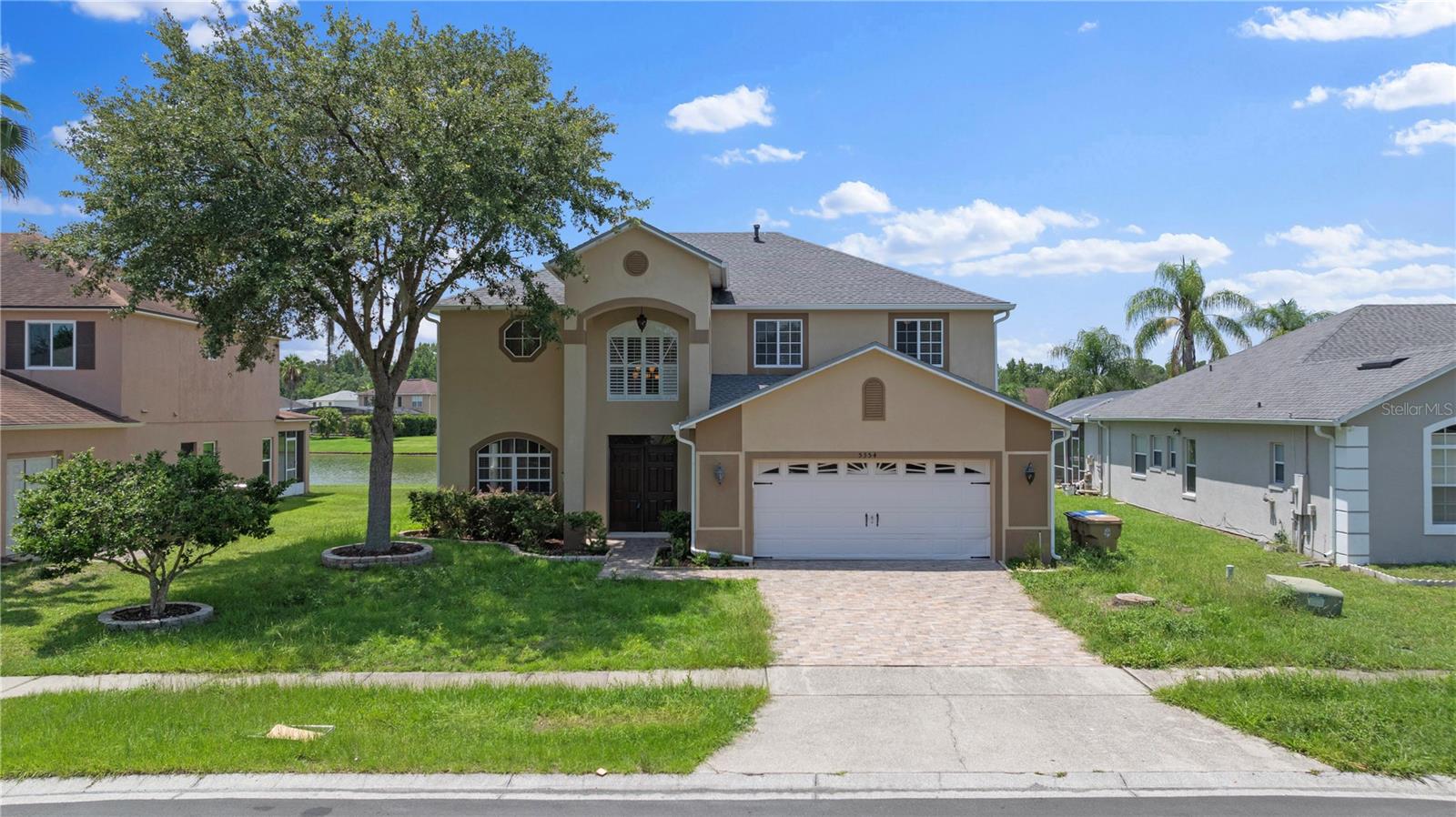 Rare opportunity to lease this spacious 5-bedroom, 3-bathroom waterfront pool home in the desirable Dahlia Reserve community. Situated on a premium lot with serene water views, this home offers an open and inviting floor plan with generous living and dining spaces, perfect for both everyday living and entertaining. The oversized kitchen features abundant cabinetry, ample counter space, stainless steel appliances, a breakfast nook, and overlooks the family room and pool area. Upstairs you'll find the primary suite offers dual walk-in closets and a spacious en-suite bathroom, while four additional bedrooms provide plenty of room for family, guests, or a home office. Conveniently located near shopping, dining, schools, and major roadways. Lawn care and pool maintenance are included in the monthly rent.