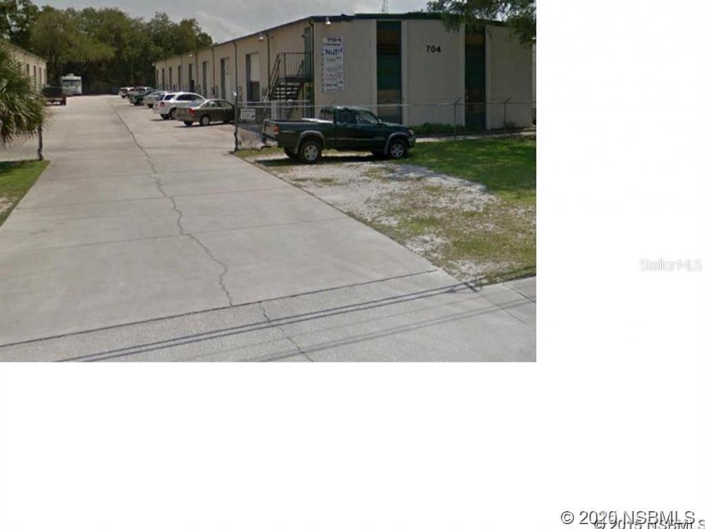 Unit D is a warehouse space with an overhead door and bathroom. This is an industrial condo, Atlantic Industrial Condominium, membership is required, and approval from the board is required. Condo fees are $155.02 for each unit. Fees cover Common Area Maintenance, water, sewer, and security lighting. No overnight parking of work vehicles is allowed.