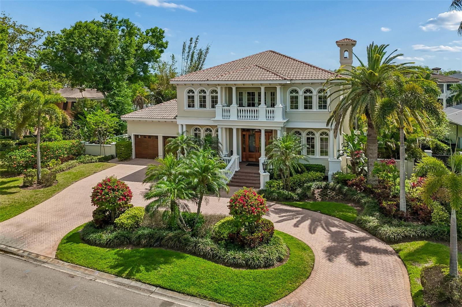 Under contract-accepting backup offers. Welcome to 4804 Culbreath Isles Rd., a Magnificent Custom Built beauty with contemporary flair set on the Grand Canal of Culbreath Isles, Tampa's top guarded and gated community.  Built in 2006 and beautifully updated and maintained, this 5663sf residence features expansive spaces for entertaining and a dock equipped for a 52 foot yacht on a protected deep water canal, 6 bedrooms including a first floor bedroom and full bath being used as an office, 5.5 baths, a dramatic two story foyer, separate sun filled living & dining room, a grand 36 x 30 family room with fireplace and wet bar and room for a pool table all overlooking the water.  The gourmet kitchen has top of the line appliances including a Viking six burner stove top and grill, SubZero refrigerator, Decor double ovens, Bosch dishwasher, huge walk in pantry and separate breakfast room.  The primary suite offers a large bath, office, and a balcony overlooking the water.  The office could be redesigned as a fabulous dressing room.  The outdoor living space has spacious covered seating, heated pool and spa, and an outdoor kitchen.  Enjoy the luxury of waterfront living in Culbreath Isles, located minutes to Tampa International Airport, top rated public and private schools, world class shopping and dining, Westshore Business District, Downtown, and the Nations Top Beaches!  You can have it all!