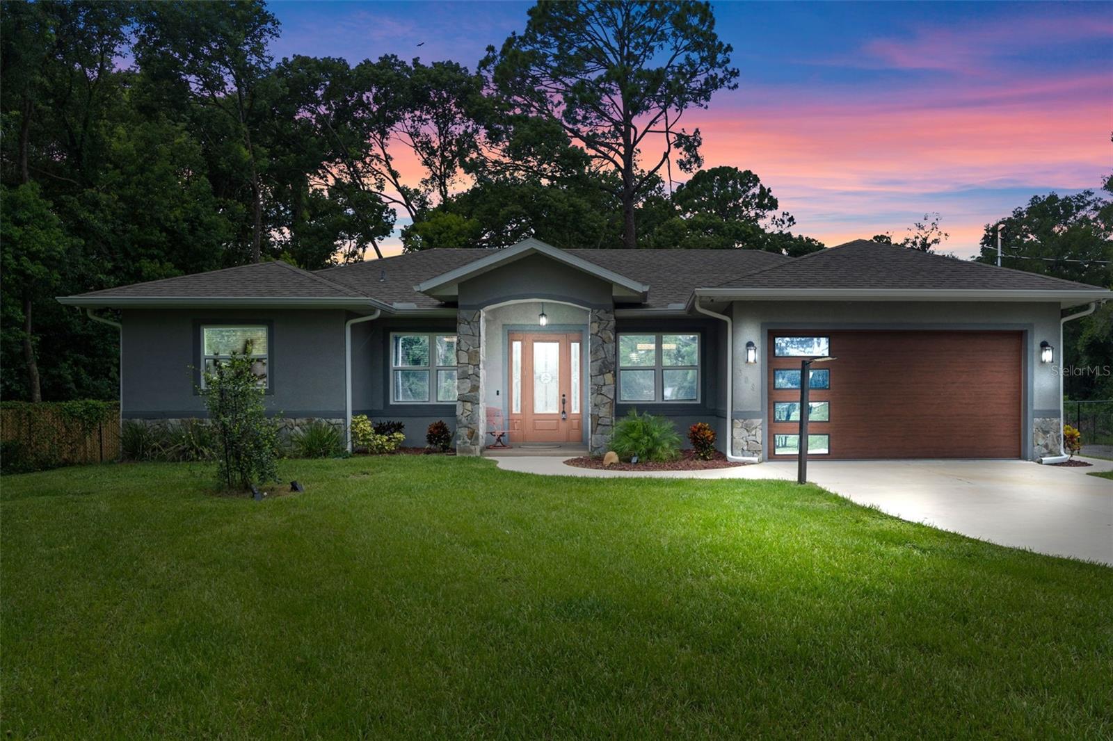 Come admire, fall in love with, and buy a true hidden gem in the quiet, quaint town of Lake Helen with NO HOA. This 4 spacious bedrooms with 2 and 1/2 bath home built in 2021 has many unique characteristics to offer in the detailed craftsmanship within minutes from I-4, only 30 minutes from coast and 45 minutes from downtown Orlando, this home is in the right spot for a piece of mind and serenity lifestyle and just a drive away to the busy and bustle of the city! 
The Master suite includes two full walk-in closets, a bathroom with double vanity sinks, garden tub and walk-in shower with a luxurious shower rain head. The open kitchen showcases flagstones tiles, granite countertops, stainless steel appliances, and plenty of cabinet space. This kitchen oversees the natural lit living area built with beautiful marble floors, built-in stone accented fireplace and shelving. Modern lighting, custom window frames, crown molding and high 10ft interior doors throughout really brings this home's charm together! Every detail allows this floorplan to flow nicely. This property sits on just shy of a 2 acre lot, offering privacy, and plenty space for additions or vehicle/boat storage for any of your needs. The rear patio also includes a covered dog kennel and enclosed shed. 08R3 allows this property to be use for many purposes beyond residential including daycare, group home location, foster care facility (please contact your local Zoning Department for the full list of options. Security Cameras Night Owl system are included. Furnitures are negotiable. Do not let this gem get away!