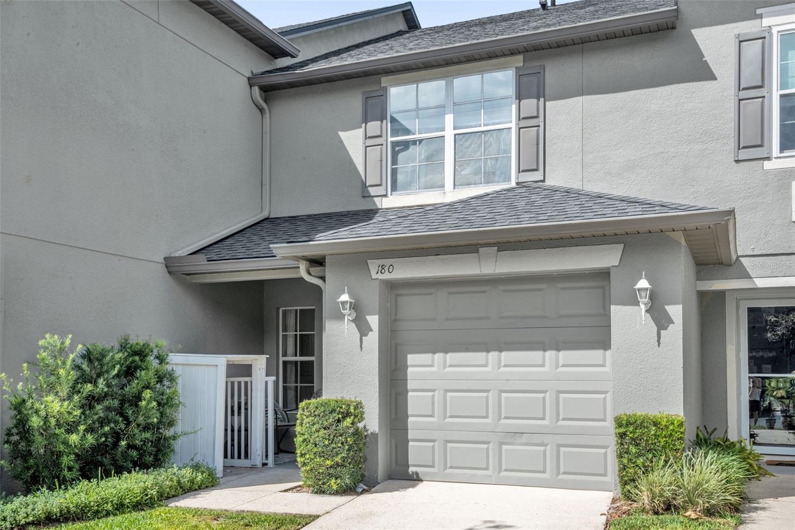 Welcome to the highly sought-after gated community of Heritage Park Townhomes in Winter Springs! This tastefully remodeled 2-bedroom, 2.5-bathroom townhome is completely move-in ready and filled with stylish custom upgrades throughout. Step inside to find a warm and inviting living space featuring a custom-built wooden mantle over the electric fireplace, creating the perfect focal point for relaxing or entertaining. The dining area showcases a stunning custom 3D accent wall adding a modern designer touch to the home. The kitchen is beautifully upgraded with quartz countertops, stainless steel appliances, and a pantry providing additional storage space. Upstairs you’ll find both bedrooms thoughtfully laid out in a split floor plan for added privacy. The spacious primary suite features a walk-in closet and an ensuite bathroom complete with quartz countertops and a stand-alone shower. The laundry area is located upstairs in its own designated hallway closet for easy access. When you step outside to your back patio, you'll notice the owners added pavers creating the perfect cozy outdoor space for relaxing evenings or late-night movies under the stars. A/c is 2022! Enjoy low-maintenance living with an HOA fee of only $300/month which includes exterior grounds maintenance, gated community access, community pool, and a playground. This unit also offers a 1-car garage, private driveway parking, and additional guest parking spaces designated for visitors. Located near shopping, dining, parks, and major roadways, this beautifully updated townhome is ready for its next owner to call home!