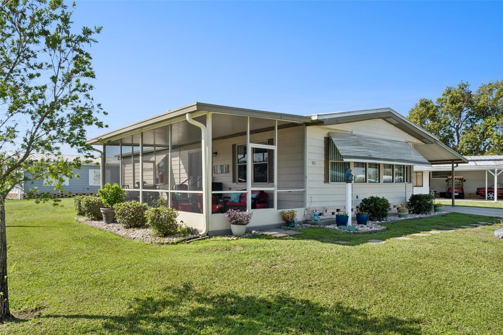 Welcome to this beautifully remodeled manufactured home in the desirable 55+ CO-OP community in Kove Estates Osteen! Situated on a spacious corner lot, this move-in-ready home has been thoughtfully updated from top to bottom, offering modern finishes and low-maintenance living. Step inside to an inviting updated (2023) open floor plan featuring updated flooring, Updated lighting, new ceiling fans, and an abundance of natural light. The fully renovated kitchen (2023) is designed for both style and function with quartz countertops, soft-close cabinetry, and ample workspace, making it perfect for everyday living and entertaining. Both updated bathrooms (2023) showcase spacious walk-in showers and updated fixtures, continuing the home's fresh, modern appeal. Major improvements provide added peace of mind, including a membrane roof (2023) and a new HVAC system (2024). Enjoy Florida's beautiful weather from the screened-in porch, offering the perfect space for morning coffee or evening relaxation. Outside, you'll find a large storage shed for tools, hobbies, or extra storage, along with the benefits of a generous corner lot that provides additional outdoor space and curb appeal. Whether you're looking for a full-time residence or a seasonal retreat, this tastefully updated home offers comfort, style, and exceptional value in the welcoming Kove Estates community. There is no lot rent, as a share in the community conveys with the sale. LOW HOA. Enjoy Year Round 9 Hole Golf Corse, 2 pools, one heated, tennis courts, pickle-ball, community events and the peaceful nights all in your very own gated community. Located just outside of Historical Sanford Fl. Sanford Airport is minutes away, Daytona Beach 40 minutes, Disney 45 Minutes away. The perfect spot to call home.
