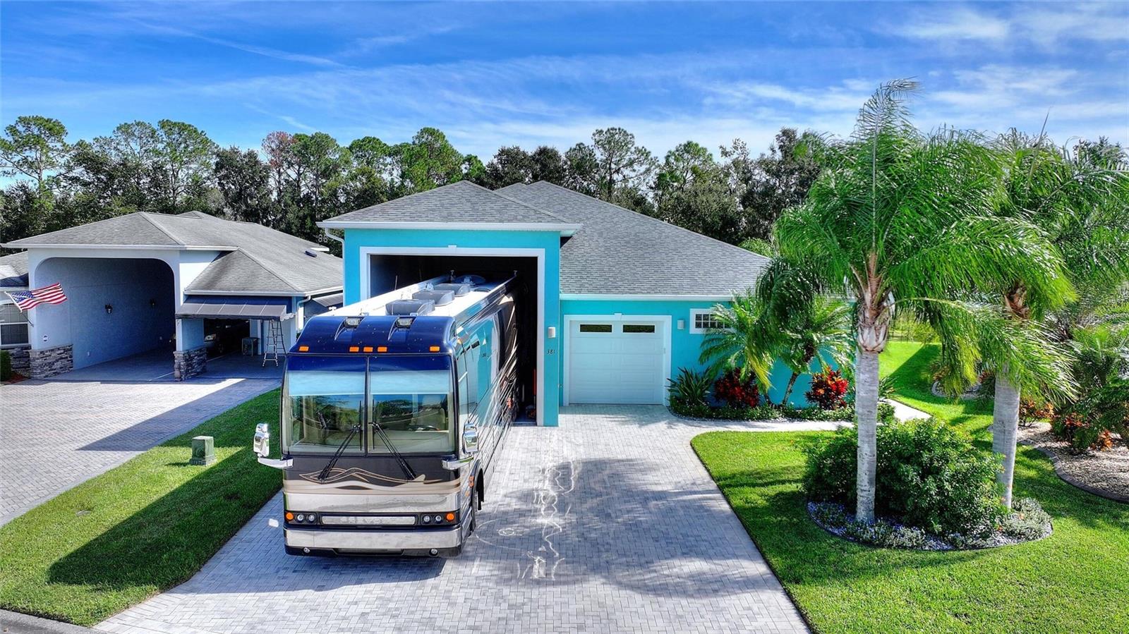 WATERFRONT ESTATE WITH 50-FOOT RV GARAGE

Discover exceptional lakefront living on 100 feet of pristine waterfront with dock-building potential. This impressive 3,936 sq ft two-story home combines luxury, versatility, and serious functionality—including a rare 50-foot attached RV garage.

---

PRIME LOCATION

Located in a gated community with 24-hour security, just steps from resort-style clubhouses. Enjoy a pool, hot tub, fitness center, tennis and pickleball courts. Second clubhouse has additional pool, hot tub, shuffleboard courts, and community pontoon boat for homeowner use.

---

THE HOME

* 4 spacious bedrooms (2 down, 2 up)
* Large kitchen with 14 foot island and great views of the waterfront
* Dedicated office/library with custom built-in desk, cabinetry, and shelving
* 4 full bathrooms
* Propane water heating plus whole-home backup generator

CHEF'S KITCHEN: 14-foot island seating six, Frigidaire five-burner induction cooktop with power boil, double ovens, dual sinks, abundant storage. Multiple sliding glass doors frame breathtaking lakefront views—seamlessly connecting indoor entertaining with outdoor living.

PRIMARY SUITE: Oversized primary bedroom with separate his-and-hers bathrooms connected by shared luxury shower. Private soaking tub and heated towel bars create a spa-like retreat at home.

UPSTAIRS: Two large rooms with endless possibilities—additional bedrooms, office space, media room, or hobby areas. 340 sq ft room includes full bathroom with shower. 400 sq ft room provides abundant space for storage or projects.

---

WORKSHOP & CREATIVE SPACE

400 sq ft climate-controlled attached workshop with ceiling-mounted dust collection system for woodworking, crafts, hobbies, or any passion project. Extensive storage includes under-stair closets and attic access. Pre-plumbed propane lines ready for future upgrades (gas dryer, cooktop, fireplace, outdoor grill).

---

LAKEFRONT LIVING

Enjoy your private 100-foot waterfront with dock-building potential. Enjoy boating, fishing, kayaking, or watching Florida sunrises from your own shore.