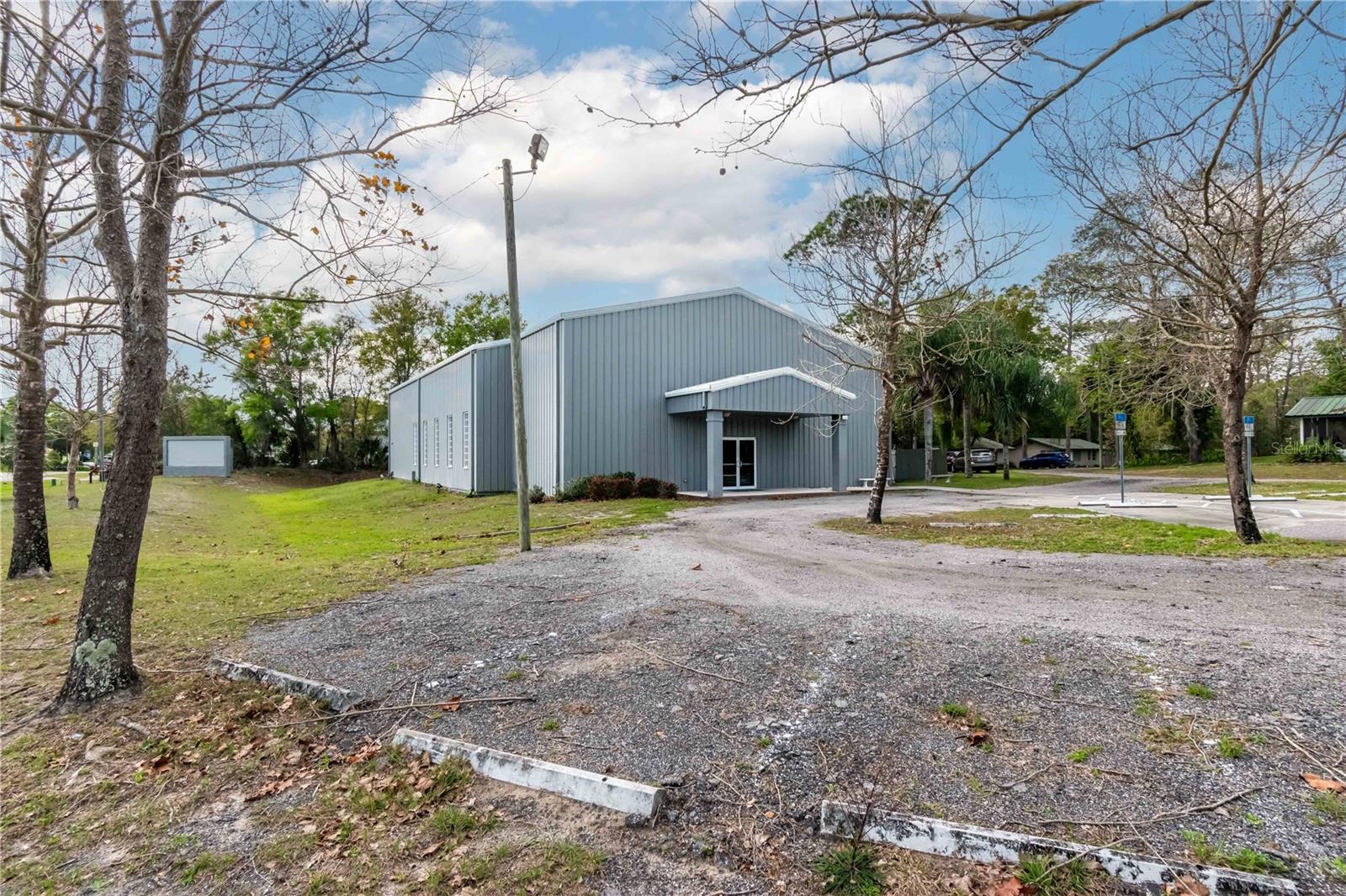 Under contract-accepting backup offers. Great investment opportunity.  Church building and cottages currently leased.   Beautiful  4.2 acres behind  church and
cottages, also zoned B4 are perfrect for development and can be purchased separately if desired. Located within sight
of I-4, and across from retail plaza and medical facilities.  Additional details provided to qualified buyers upon request