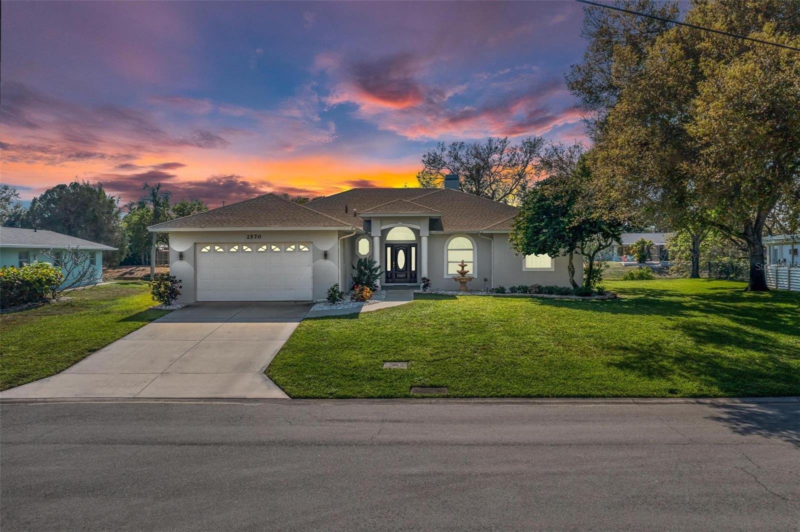 SELLER WANTS AN OFFER! Welcome to the tranquil community of South Gate on secluded River Ridge Drive where you may canoe and kayak in Phillippi Creek right behind your home! This is the home you will be proud to entertain your guests in with water frontage, soaring 23 ft. cathedral ceilings, optional community pool with clubhouse and gorgeous sunsets. Enjoy the therapeutic fountain by the covered entry with etched glass entry door. Foyer with half bath and coat closet. Large living room for relaxing boasts soaring cathedral ceilings, plant shelves, gas fireplace with wood floors and disappearing sliding glass doors to lanai. Spacious Dining Room to entertain family and friends with lovely bay window and double doors to lanai. Beautiful Kitchen with breakfast bar, stainless steel appliances, backsplash, and closet pantry. Office/Den/Nursery has double glass doors to Living Room with closet. Spacious Master Bedroom has double glass doors to lanai, double tray ceiling, mini-split air conditioner for extra comfort, walk-in closet and niche. Lovely Master Bathroom opens to office/den/nursery with jetted garden tub, dual sinks, walk-in shower, linen closet and water closet. Second bedroom with mini-split air conditioner for extra comfort and closet. Third bedroom with closet. Guest bathroom with tub/shower combo and vanity. Split open floor plan. Under air laundry room with washer, dryer, cabinets and laundry tub. 10 ft. high ceiling throughout. Large 2 car garage with extra space for storage and attic access. Huge lanai with finished concrete floors and screen door to backyard for peaceful mornings drinking coffee watching the wildlife, listening to the birds chirp and evenings watching the spectacular sunsets. BRAND NEW ROOF 1 YEAR AND BRAND NEW A/C MARCH 2023. Shue Kaufman quality construction. Immaculately maintained. Close to shopping dining, arts/culture, major league sporting events, theme parks, and only 6 miles to world famous #1 Siesta Key Beach. Plenty  of space to add a pool. Make this lovely home yours today and start living the Florida lifestyle!