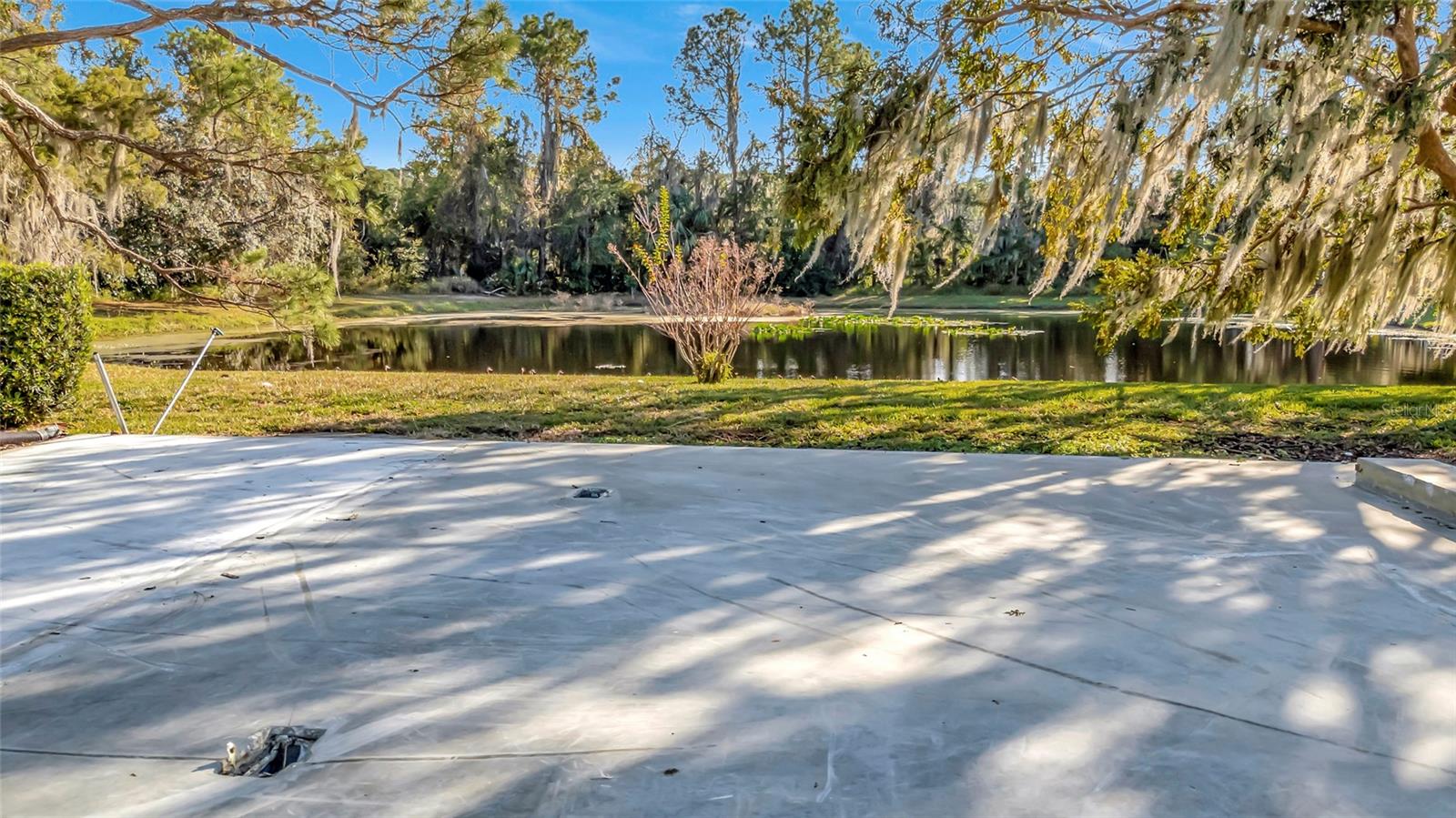 BACK ON MARKET! AMAZING OPPORTUNITY — PRICED UNDER MARKET VALUE! CUL-DE-SAC, INCREDIBLE VIEWS, CANAL FRONTAGE AVAILABLE LOT in one of the most peaceful and picturesque settings in Imperial Terrace — a rare oversized, build-ready lot located on a quiet cul-de-sac with water access on both sides for your perfect Florida lifestyle experience. From the front of the property, enjoy canal frontage directly across the street from the community marina, providing navigable access to the Dora Canal, Lake Eustis, Lake Dora, and the full Harris Chain of Lakes — ideal for boating, fishing, and sunset cruising. From the rear of the lot, you are treated to a serene private pond view with no immediate rear neighbors, where whistling ducks, birds, and abundant wildlife create a truly tranquil backdrop. The previous home has already been removed, leaving a defined concrete home pad ready for immediate placement, and the impact fees have already been PAID — a massive savings and a rare advantage for buyers ready to build now. The lot itself is generously sized and positioned to capture both water views and unmatched privacy. ?? Imperial Terrace – Peaceful, Active 55+ Living with Resort-Style Amenities • Low HOA Fees • NO Lot Rent – You OWN Your Land • Heated Pool & Clubhouse • BBQs, Shuffleboard & Resident Activities • Community Marina & Boat Ramp with Harris Chain of Lakes access Imperial Terrace is a highly sought-after 55+ community known for its peaceful atmosphere, friendly neighbors, and active social lifestyle. Located just off Highway 441, residents enjoy quick access to shopping, dining, medical facilities, plus beloved destinations like Mount Dora and The Villages. Easy commutes to Orlando, beaches, and major airports make this ideal for both year-round and seasonal living. Incredible views. True tranquility. Paid impact fees. No lot rent. Priced to sell. This is a rare waterfront lifestyle opportunity that truly has no equal currently on the market.