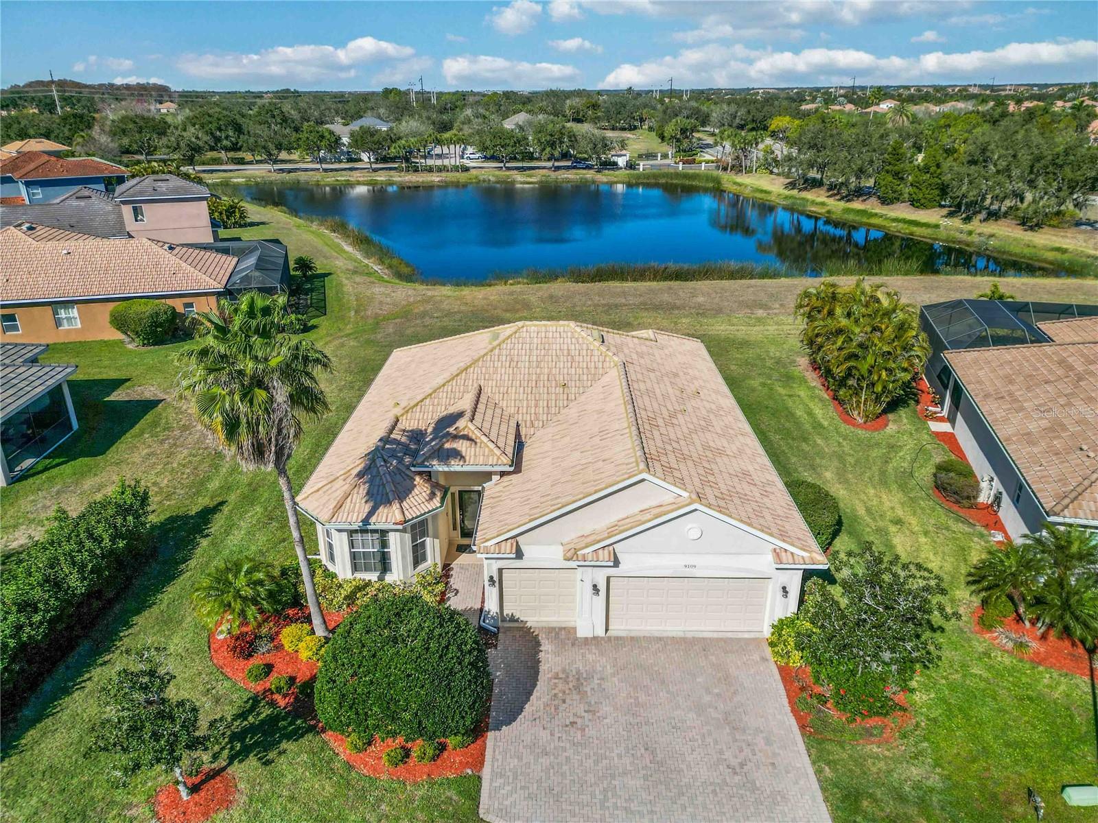 Located in the gated golf community of Stoneybrook at Heritage Harbour, 9109 Winter Harbour Way offers the water view, spacious ¼-acre lot, and quiet cul-de-sac location buyers have been searching for. This 2174 sqft home features 3 bedrooms plus a den and a 3 car garage, providing a flexible layout ideal for a home office, guest space, or hobby room.The open floor plan creates a bright and comfortable living space, while large windows frame peaceful water views from the main living areas. Situated within a gated golf community with optional golf membership.This open-concept home features tile flooring throughout, a tile roof, a paver driveway, and peaceful water views. The den offers flexible space for a home office, guest room, or additional living area, making the layout ideal for full-time residents or seasonal Florida living. Stoneybrook at Heritage Harbour is one of Bradenton’s most amenity-rich communities, offering a fitness center, resort-style swimming pool, playground, tennis courts, pickleball courts, basketball courts, baseball and soccer fields, disc golf, and sand volleyball courts. The home is two minutes from The Marketplace at Heritage Harbour, providing immediate access to grocery stores, restaurants, coffee shops, and everyday conveniences. Located just minutes from Interstate 75, residents enjoy easy commutes to Lakewood Ranch, Sarasota, Tampa, and St. Petersburg. The area’s white sandy Gulf beaches, including Anna Maria Island and Holmes Beach, are a short drive away, along with nearby airports, shopping centers, and waterfront dining. Zoned for Freedom Elementary School, Carlos E. Haile Middle School, and Parrish Community High School, this home offers an ideal combination of location, lifestyle, and convenience in the heart of Manatee County. Don't be shy...Let's talk.