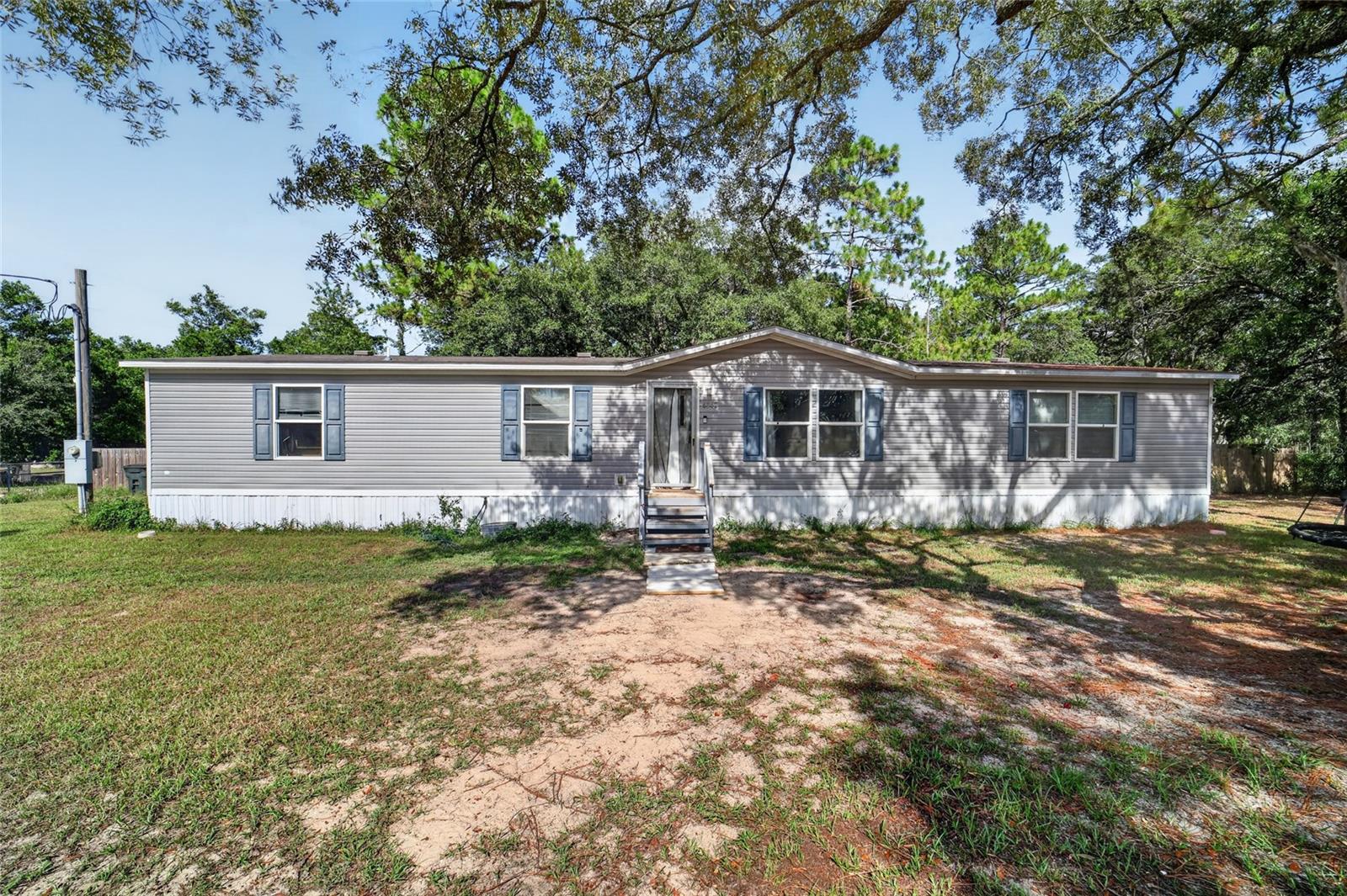 Escape to the peaceful charm of Homosassa with this beautifully maintained 2019 manufactured home situated on nearly a full acre of high and dry land. Offering 4 bedrooms, 2 bathrooms, and 1,768 square feet of living space, this property combines modern comfort with the freedom and privacy of country living.

Step inside to find a spacious, open-concept floor plan designed for both everyday living and entertaining. The generous living areas flow seamlessly into the kitchen and dining space, creating a warm and inviting atmosphere for family and friends.

Outside, the expansive 0.95-acre corner lot provides endless possibilities. The property features an impressive 11x20 storage shed, perfect for a workshop, storing tools and equipment, or housing all of your recreational gear. A large above-ground pool offers the opportunity to create your very own backyard oasis—with a little TLC, this space could become the ultimate spot for relaxing, entertaining, and enjoying Florida's beautiful weather. There's also plenty of room for boats, RVs, trailers, gardens, and future additions, giving you the freedom to truly make this property your own.

Conveniently located just minutes from shopping, dining, and everyday amenities, and approximately 15 minutes from the Homosassa and Chassahowitzka Rivers with direct access to the Gulf of Mexico, you'll enjoy the best of Florida's Nature Coast lifestyle right at your doorstep.

Whether you're searching for a full-time residence, a seasonal retreat, or an investment opportunity, this property offers space, privacy, and endless potential in one of Citrus County's most desirable locations.
