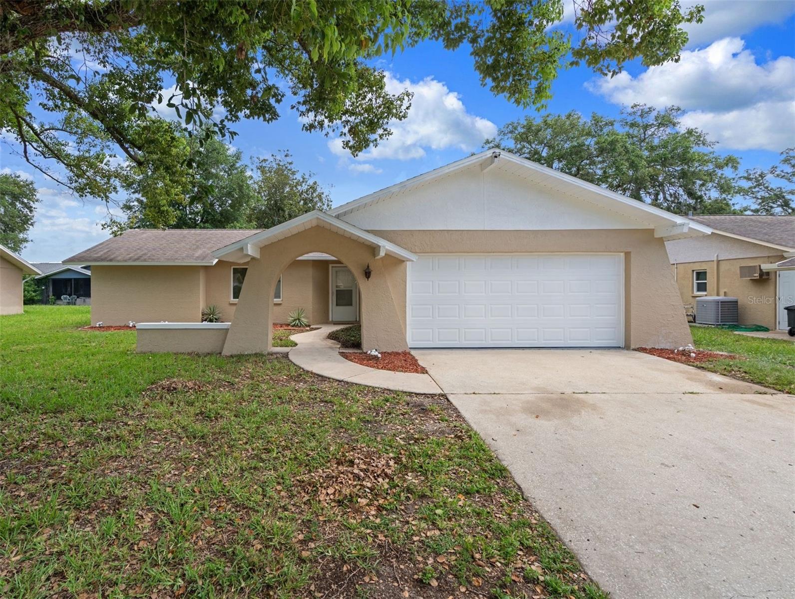 Welcome to this stunning, completely remodeled home in the highly desirable community of Greenbrook Estates! This move-in ready 2-bedroom, 2-bathroom home offers 1,388 sq/ft of beautifully updated living space with a 2-car garage and showcases high-end finishes throughout. From the moment you step inside, you'll be impressed by the brand-new luxury vinyl plank flooring (2026), fresh interior and exterior paint(2026), new doors throughout, updated lighting, modern fixtures, and designer touches at every turn (2026). The heart of the home is the gorgeous, fully remodeled kitchen (2026) featuring elegant quartz countertops, shaker cabinets, stainless steel appliances, a stylish tile backsplash, an eye-catching Art Deco accent wall, and all-new hardware and fixtures. Both bathrooms have been completely renovated with today's most sought-after finishes. The spacious primary suite has a large walk-in closet and boasts a luxurious walk-in tiled shower complete with a built-in bench and niche, a new vanity, updated mirrors, lighting, and premium fixtures. The guest bathroom has been equally transformed with a beautiful new tub/shower combination, new tile, vanity, mirrors, fixtures, and lighting (2026). Additional updates include a Roof (2019), A/C (2017) with a brand-new thermostat, giving buyers added peace of mind. Inside laundry room. Enclosed lanei perfect for sipping your morning coffee! Enjoy the benefits of NO flood insurance required, LOW HOA fees, and NO CDD fees. Residents also have access to a community clubhouse and pool. Conveniently located near shopping, restaurants, parks, and entertainment This home truly offers the perfect combination of style, comfort, and location. Don't miss your opportunity to own this COMPLETELY REMODELED MOVE-IN READY HOME!!!! This home will surely check all the boxes!! Schedule your private showing today!