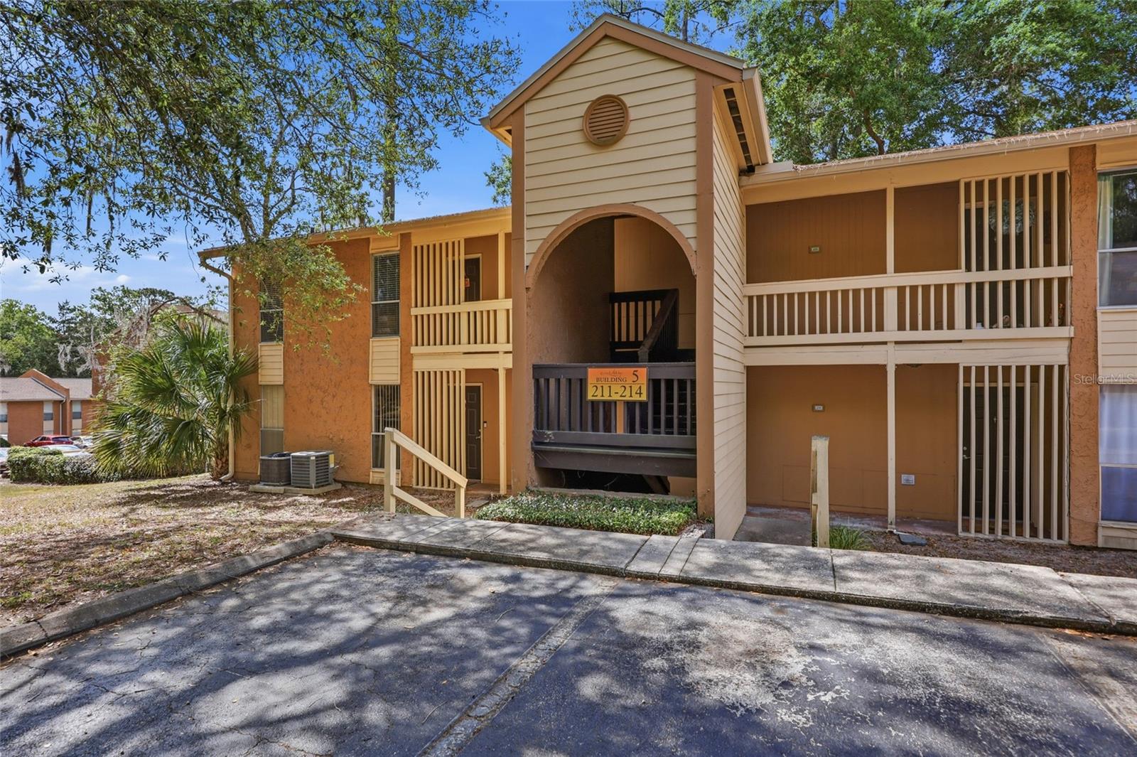 Conveniently located in the heart of town, just 2.3 miles to UF/hospitals, easy biking distance to UF, and access to nearby bus transit, restaurants, and shopping.  This beautiful and quiet neighborhood is nestled in a park like setting with lovely trees, walking paths, and a picturesque creek running through the property.   This community offers fantastic amenities including a pool, fitness center, tennis courts, and a clubhouse.  This second story, end unit is spacious with 760 SF, and has a balcony off of the great room where you can enjoy the peaceful views of the mature trees and landscaping.  You will love the open floorplan with luxury vinyl flooring, granite countertops and stainless appliances in the kitchen.  The kitchen includes a microwave, oven/range, refrigerator, dishwasher, a washer/dryer combo, and an island for additional storage.  The bedroom has an ensuite bathroom and ample closet space.  You will love living in this affordable home with luxury amenities.  Relax, it's a stable Condo Assn. with no assessments.  The seller is in the process of replacing the water heater and the electric panel.  Don't miss out on this great opportunity to call this place home!