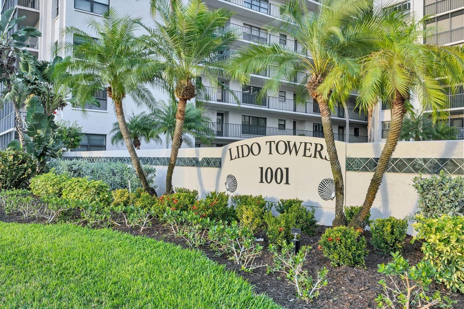 Corner Unit 201 at Lido Towers is the kind of Lido Key opportunity that doesn’t come along often—easy, coastal living with flexible rental options when you want them. Located on the Northwest side of the building, this residence captures refreshing Gulf breezes and beautiful natural light, with windows on two sides that keep the space feeling open and bright all day long. The 2023 remodeled kitchen is a standout, featuring an enlarged opening to the dining room that instantly improves flow for entertaining and everyday living. The great room and eat-in kitchen connect seamlessly to a screened wrap-around balcony that adds approximately 215 sq. ft. of outdoor living space—maintained by the association, so your time is spent enjoying Lido, not working on it. And then there’s the lifestyle piece that matters most: private beach access directly across the street—a true owners-and-guests-only oasis where you can slip away for sunrise walks, afternoon reads under the Palm Trees, and those classic Sarasota sunset strolls without the public crowds. Lido Towers offers a heated pool, whirlpool, outdoor grills, north and south elevators, and a 5' x 6' storage locker on your floor for personal use. Both bedrooms have private bathroom access, and both baths feature newer cabinets and fixtures. Major updates add peace of mind with a new A/C (Dec. 2025), new roof, and recently updated elevators and entryways. The building is pet- and rental-friendly, and Unit 201 has strong rental history with approximately $14,000 in rental income and existing reservations already in place for 2026 February - March. Condo dues are $997 and include water—a real value on Lido Key. If you’ve been waiting for a smart way to own on the Key—enjoy it now, rent it when you want, and keep it simple—this is your moment to stake your claim and start living the Lido life.