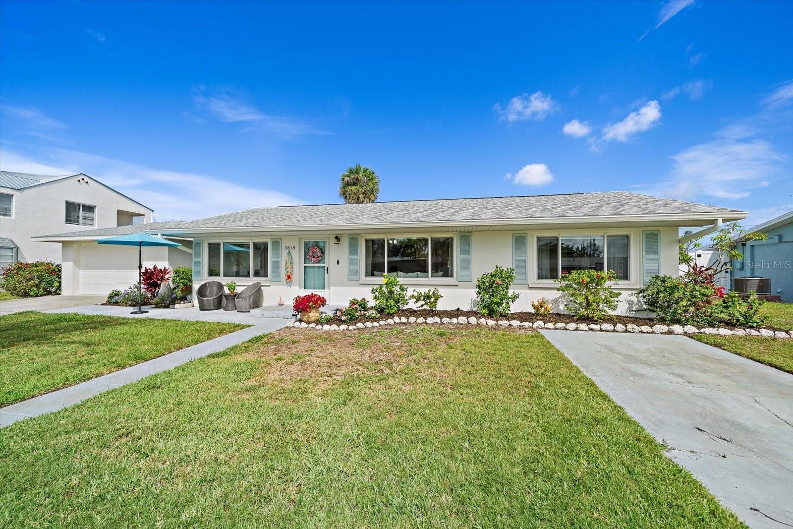 Want to live the ultimate island life for a fraction of the price? This beautifully updated pool home on a manicured, fully fenced quarter-acre lot has it all with zero deed restrictions. Located in an eclectic, charming "Old Florida" neighborhood, you are just 700 feet from a community boat launch providing seamless access to Palma Sola Bay, Sarasota Bay, and the Gulf of Mexico. Cruise to the historic Cortez Fishing Village for the fresh catch of the day in just 2 minutes, or take a quick 5-minute drive (or 10-minute bike ride) to the pristine beaches of Anna Maria Island—you can even enjoy views of Palma Sola Bay right from your front window! Inside, the beautifully updated interior features ceramic tile flooring throughout, an open kitchen/family room combo with granite countertops and stainless steel appliances, and a desirable split-bedroom floor plan. The indoor-outdoor flow leads to a massive 30x12 Florida room overlooking your private, solar-heated saltwater pool—your own backyard tropical oasis perfect for entertaining and a safe haven for pets. Major big-ticket upgrades provide ultimate peace of mind, including a brand-new roof (2025), a newly replaced central A/C system (2024), 130mph high-impact hurricane windows throughout (except two small windows), and an updated electrical system equipped with whole-house surge protection. Storage is an absolute breeze with an extra-deep, detached 1.5-car garage to house your vehicle and gear, plus a dedicated parking pad outside with plenty of room to park your RV or boat. Whether you are looking for a primary coastal retreat or a standout investment, this Bradenton gem delivers unmatched location, convenience, and value. Be sure to check out the Matterport 3 D walk through and Video Tour!