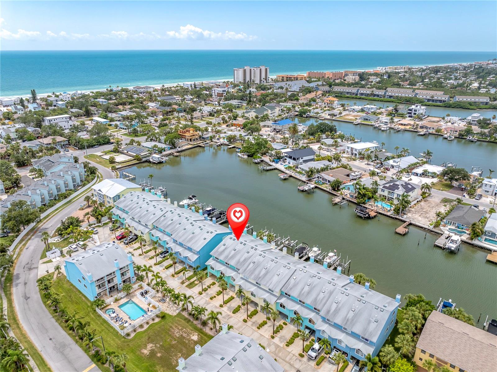 Picture this: morning coffee on your private waterfront balcony, boat gassed up and ready at your own dock, then a short, walkable stroll to Indian Rocks Beach for the afternoon, come back and take a dip in the pool. This is everyday life at 128 Marcdale Blvd — a fully renovated, spotless, like-new 3-bedroom, 3-bath Sunset Bay townhome in Indian Rocks Beach, with 1,656 sq ft heated (2,500 sq ft total), where the Intracoastal Waterway is your backyard and the Gulf is a short stroll away.
Waterfront, on your terms. A deeded boat slip with a 12,000-lb lift (new control box, 2024) puts the water at your disposal whenever the mood strikes — no marina, no waiting. The seawall, boardwalk, electrical, and dock system were fully rebuilt in 2021, so it's not just a view, it's a functioning waterfront setup ready to use. Two private balconies — one off the main living level, one off the primary suite — give you a front-row seat to the peaceful waterfront from morning light to sunset.
Move-in ready, spotless condition. Every detail here has been cared for. The main level is light-filled and open, with a fireplace, porcelain tile plank style floors, and a laundry closet with folding shelf on the main floor. One private ensuite bedroom works beautifully as a guest suite or home office. A fully remodeled kitchen with soft-close, solid wood shaker cabinets in a two-tone finish, quartz counters, a floor-to-ceiling glass mosaic backsplash, built-in stainless appliances, a dual-zone wine fridge, and designer pendant lighting over a generous breakfast bar for easy entertaining.
A primary suite that feels like a retreat.
Upstairs, vaulted ceilings set the tone, and the spa-style bath is the showstopper — a frameless glass shower wrapped in floor-to-ceiling marble-look tile with a rain shower head and built-in seat, plus dual vanities with exotic stone counters and oil-rubbed bronze fixtures. Its own private balcony means your morning coffee spot is never shared. A third bedroom overlooks the community's resort-style pool and spa.
Storage and space, handled
An oversized tandem garage handles bikes, paddleboards, beach chairs, or doubles as a home gym or workshop — wall to wall built in storage, garage fridge, epoxy garage floor and a retro utility sink that makes this garage feel like more like living space. A travertine patio with a misting system extends outdoor living through the warmer months.
The big-ticket items, already done
Roof (2014, 20-year warranty), HVAC (2019), hurricane windows and doors (2016/2025), new hot water tank and front door (2025) — the kind of updates that let a buyer move in and simply enjoy the place. 2026 HOA is $833.69/month, covering insurance (hurricane, flood, hazard), exterior maintenance, landscaping, pest control, the community pool and hot tub, and water/sewer/trash.
Indian Rocks Beach, at your pace
This golf-cart-friendly, walkable stretch of the Gulf Coast is built for slowing down — beach access, boat ramps, casual waterfront dining, and boutique shopping all within easy reach, with Tampa and the airports a quick drive when you need them. Pet-friendly, too.
Bring your boat. Call now to see it in person.