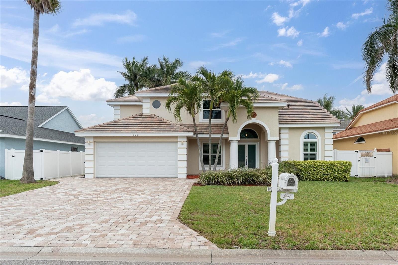 One or more photo(s) has been virtually staged. Welcome to this stunning 3-bedroom, 3-bathroom pool home with a 2-car garage, nestled in the sought-after waterfront community of Tierra Verde. Major updates include a new tile roof (2025), hurricane-impact windows and doors throughout, a new garage door (2021), fully updated bathrooms (2017), a new paver driveway (2020), and an epoxy-coated garage floor (2022). 
The first-floor primary suite offers privacy and convenience, featuring sliding doors to the pool, a large custom walk-in closet with additional storage, and a spacious ensuite with wrap-around double vanity, stand-up shower, garden tub, and a separate water closet. Hurricane-impact sliders connect the interior to your outdoor oasis — a large covered patio with a newly screened enclosure (2025), a Pebble Tec-resurfaced pool and spa (2017), new plumbing (2025), new pool filter (2025), and a suburban gas pool/spa heater (2022) for year-round enjoyment. Five separate access points lead to the pool area, surrounded by lush, tropical landscaping for added privacy. The kitchen features granite countertops, stainless steel appliances, a new Bosch dishwasher (2025), and a new built-in microwave (2024), opening directly to the second living area — a flexible, multi-purpose space with the third bathroom conveniently adjacent and pool access nearby. An interior laundry room with a sink and storage is located just off the kitchen. Additional features include plantation shutters, a water softener and drinking water purification system, a Smart Tint privacy door, and an average Duke Energy bill of approximately $210/month. Upstairs, two additional bedrooms share a full bath with a hallway workspace area.
No damage or flooding from recent storms. An assumable VA loan at 2.75% is available for qualified veterans.
Tierra Verde offers an unmatched lifestyle — minutes from St. Pete Beach, Pass-A-Grille, Fort De Soto, and vibrant downtown St. Pete. Isla Del Sol Yacht & Country Club is just down the road, offering golf, tennis, pickleball, and fine dining. With top-rated restaurants, waterfront parks, biking trails, kayaking, paddleboarding, and a dog-friendly waterfront park all nearby, this is island living at its finest.