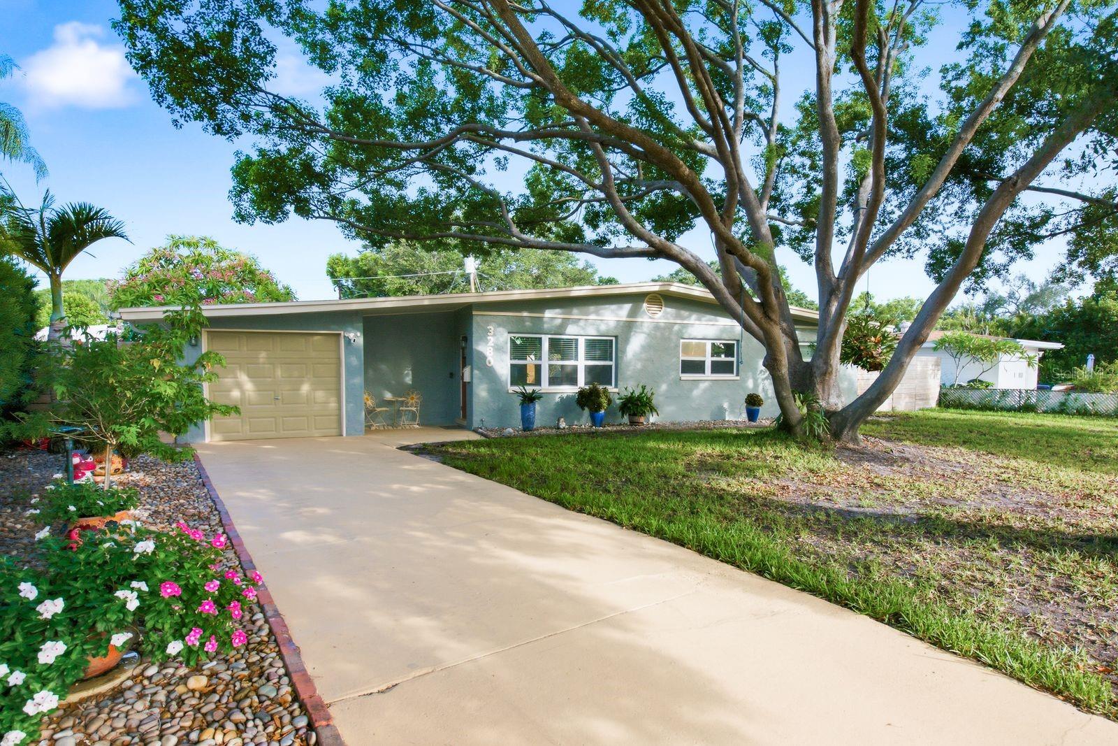 Lovingly cared for and nicely updated concrete block home in St. Petersburg's Westgate Manor neighborhood. Roof replaced 2021. New water heater, refrigerator, and dishwasher (2026). Interior and exterior paint updated 2025 to 2026. French doors. Hurricane shutters on every window. Spacious indoor laundry room.

Custom aluminum-framed gate opens to extra parking for a boat, RV, trailer, or additional vehicles. Covered deck with gazebo. Custom brick patio, ready for a fire pit or water feature. Custom privacy fence (2022). Rock landscaping with automatic drip irrigation. New storage shed (2026). Attached garage. No HOA. Flood Zone X. Zoned for Westgate Elementary, Tyrone Middle, and St. Petersburg High. Minutes from Publix, Tyrone Square Mall, and Home Depot, about 15 minutes to the beach.