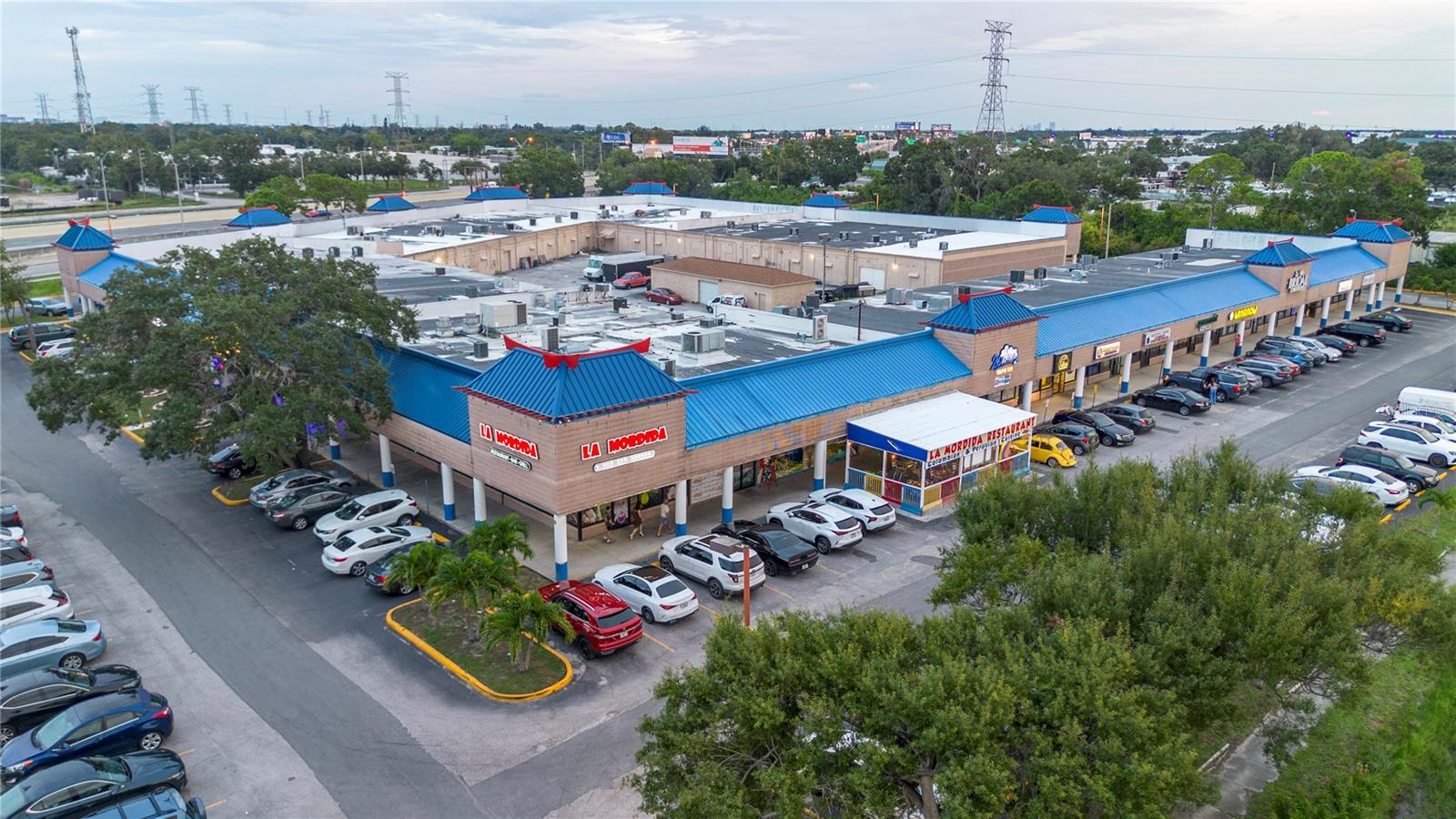 An unique investment opportunity awaits you at the convergence of two bustling roads in Central Pinellas County. Little Saigon Plaza sits on 6.5 acres of land just south of the fork of US 19 N and 66th St. with frontage on both. The plaza is at 100% capacity, with strong, historied tenants offering just under market rates giving investors plenty of upside. The building is a 64,388 sq ft strong block structure located high and dry in an X flood zone. The plaza has 39 tenant spaces, ranging from 900 to 11,000 sq ft a piece. The property sees over 90,000 vehicles per day from US 19 and 66th St. And accessing the property is a breeze since it has a signaled intersection on 66th St and access to a Frontage road on US 19. The surrounding area has a very dense population with approximately 102,000 people within 3 miles and a average household income of $53,000.00. The land including the undeveloped parcel is zoned CG, providing a diverse amount of development options