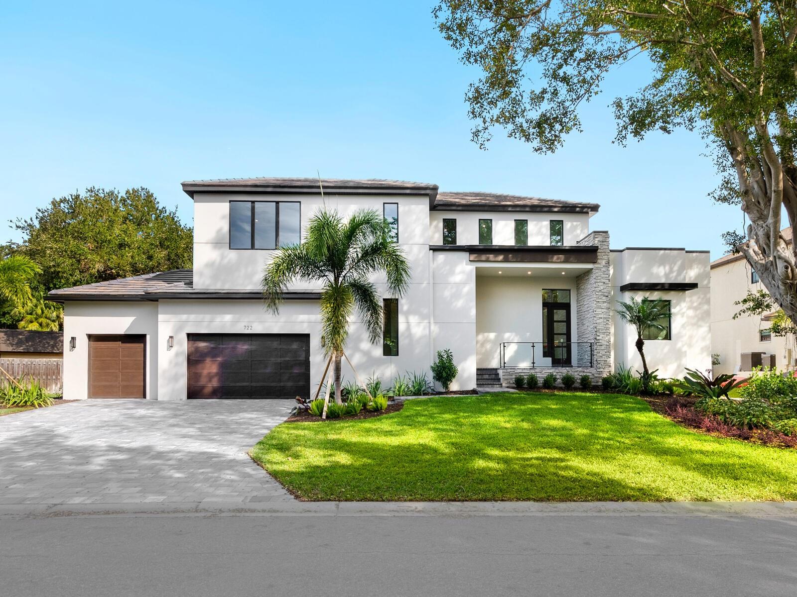 PRICE IMPROVEMENT! This gorgeous island paradise is sure to be another award-winner from notable home builder Allegra Homes. The coveted sailboat water location allows for quick and easy boating access to the IntraCoastal Waterway and the Gulf of Mexico. This 4 bedroom, 4.5 bath home has been perfectly designed with extraordinary thought and precision. Easily described as elegantly comfortable, the open family room provides a wonderful space for personal relaxation or a great spot for special gatherings with built-in entertainment center, two-story ceiling, linear electric fireplace with stone surround, and wall of sliders opening up to a vast covered outdoor living area. Next to the family room is an incredible chef-styled kitchen with large center island, Cambria quartz countertops, SubZero refrigerator and wine cooler, ASKO quiet series dishwasher, Wolf 36” cooktop and oven, drop-down microwave, and walk-in pantry.  The spacious main level owner’s wing is a delightful oasis and set completely on one side of the house for the utmost in privacy. Its spa-influenced bath feels grand with a free-standing tub, stunning walk-in tiled shower with rain head, private water closet and double vanities. The huge bonus room features corner sliders which can open up the room to become part of the covered outdoor living room with a complete cook center. With a backdrop of lush landscaping beautifully lit at night, the rear of the house is all about the tropical lifestyle with lots of covered square footage and a gas heated pool/spa. The media room with wet bar is upstairs as are 3 bedrooms (2 are en suite) and a balcony overlooking the main level below. Additional highlights include 3-car garage, elevator shaft, tankless gas water heater, 240-gallon propane tank, brick paver driveway and entry, 3-zone A/C, 5” cove molding, European oak flooring, covered front entry, Moen and Kohler fixtures, bedroom closets are walk-in and shelved, and irrigation system with well. Just a short distance away is worldrenowned Crescent Beach and quaint Siesta Village with an impressive selection of shops and restaurants. There’s nothing much better than living in an amazing new home on the picturesque Florida waterfront. NO bridges to the open bay.