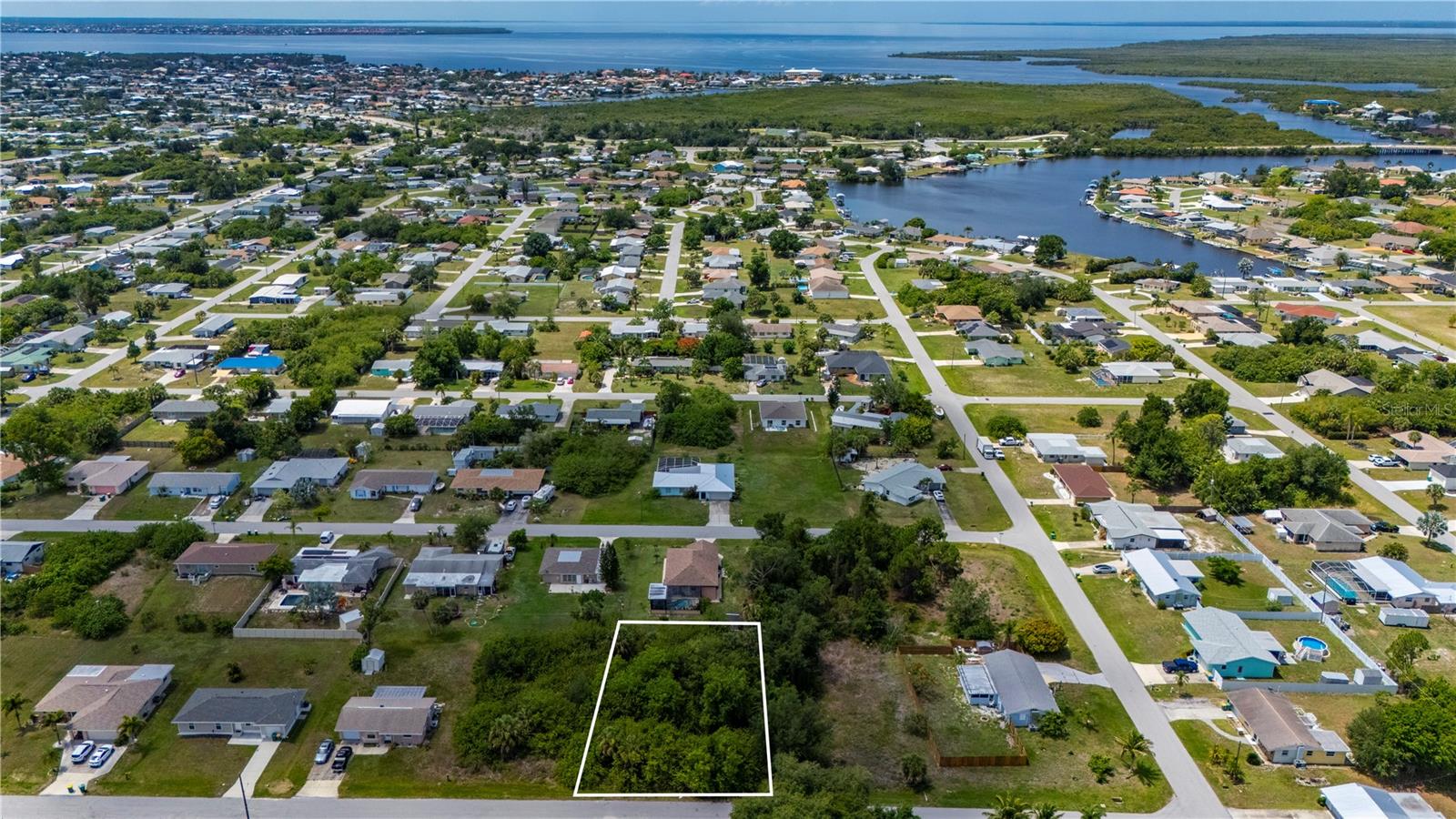 Build your Florida dream home on this residential lot located in an established Port Charlotte neighborhood. Conveniently situated near shopping, restaurants, schools, medical facilities, and everyday amenities, this property offers an ideal blend of privacy and accessibility. Enjoy being just a short drive from Charlotte Harbor, public boat ramps, world-class fishing, golf courses, Fishermen’s Village, and historic downtown Punta Gorda. Beautiful Gulf beaches including Englewood, Venice, and Boca Grande are all within easy reach. With convenient access to US-41 and I-75, traveling throughout Southwest Florida is a breeze. Whether you’re ready to build now or invest for the future, this property presents an excellent opportunity in a growing area.
Seller owns a total of six vacant parcels located throughout Port Charlotte and Punta Gorda and may consider individual sales or a portfolio purchase. This property is being marketed and priced individually. Contact listing agent for information regarding additional available parcels and potential package purchase opportunities.