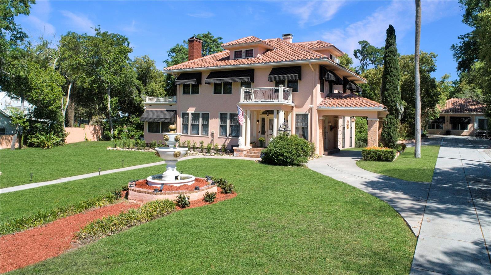 New Pricing for this Florida Charm or turnkey opportunity! Step into history with this remarkable 1926 estate, proudly listed on the National Register of Historic Places and nestled in the desirable residential area of Mount Dora. Whether you envision a private residence or a thriving hospitality venture, this property offers the rare flexibility to serve as either—or both—as it currently operates as a fully functioning Bed & Breakfast.
Thoughtfully maintained and updated, the property underwent major renovations in 1994, including updated electrical and plumbing systems and new sprinklers throughout. Recent improvements include new A/C units (2020), new roof and awnings (2018), updated basement water line valves and a fully renovated irrigation system (2024). A detailed list of upgrades and repairs is available.
The estate features a porte-cochere and four distinct structures: the main residence, a Carriage House, a 480 sq ft multi-purpose building known as the “Quilt Room,” and an 8" x 12"lighted shed.  Inside the main home, you’ll find six beautifully appointed bedrooms—The Fitzgerald, Hemingway, Gatsby, Lombard, and Charleston, each with recently updated en-suite baths. The Charleston Room offers a private exterior entrance, ideal for Airbnb use. The finished attic “Penthouse” includes a full bath and serves as the sixth bedroom. The Carriage House is a fully self-contained suite complete with a kitchen, living room, bedroom, bathroom, and its own dedicated A/C—perfect for guests, extended family, or rental income. The Quilt Room adds 480 sq ft of heated and cooled flexible space, with prior approval to convert it into an additional bedroom and bathroom.  Upon entering the main home, you’re welcomed by a grand staircase and stunning original hardwood floors. The main level offers a large living room with an electric fireplace (convertible back to wood-burning), formal dining room with a table for 10, sunroom, and a spacious family room with French doors leading to one of two inviting patios. The kitchen features a dual-fuel commercial range and a breakfast nook currently used as office space.  Additional amenities include a 475 sq ft basement for storage and laundry.  Located on sought-after 3rd Avenue, this property is just moments from Mount Dora’s charming shops, restaurants, and renowned festivals. With convenient access to Orlando, nearby beaches, and major airports, the location is as appealing as the home
itself.  This one-of-a-kind estate offers endless possibilities—don’t miss the chance to make it yours. Be sure to view the 360-degree Matterport tour.