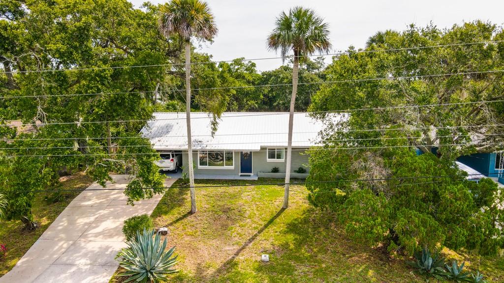 Recently remodeled beach-side 3/2 block house in a great location. Porcelain tile throughout, custom ship lap in living and dining rooms. All new electric wiring, panel and LED lighting. New a/c and duct-work throughout. New natural gas service to home with tank-less water heater, dryer, range and plumbed for outdoor kitchen. Beautiful new kitchen cabinets, premium quartz counter tops, Kohler farmhouse sink and fixtures, LG black stainless (refrigerator, dishwasher, gas range) KitchenAid under counter convection microwave, under cabinet lighting and custom vent hood.  Completely remodeled guest bathroom with glass tile and weathered wood vanity.  Master bathroom has also been completely remodeled with large shower and double vanity. All new interior and exterior doors as well as fresh paint inside and out. Metal roof replaced in 2016. This lovely home overlooks a biking and jogging path across the street that runs alongside the Indian River Lagoon. South along the bike path are nature trails and a kayak launch area or go just 2 blocks over to the Beach. ;Water: City