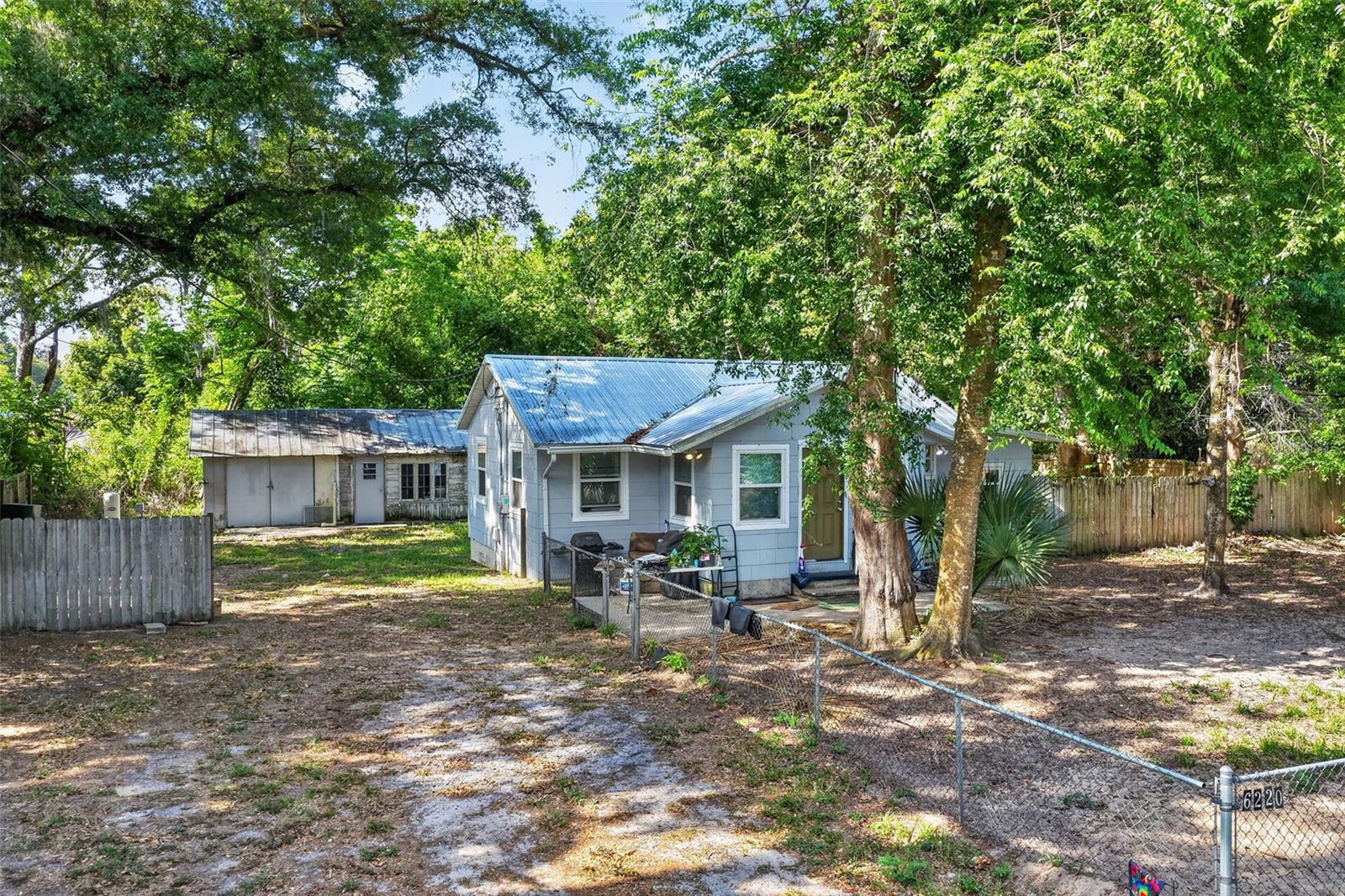 Unique investment and mixed-use opportunity in Belleview! Rare B-2 (Community Business) zoning offers exceptional flexibility for residential, commercial, or live/work use. This fully remodeled 2-bedroom, 1-bath home with bonus room sits on a spacious 0.31-acre lot and features a new metal roof and new A/C for peace of mind and low maintenance ownership. Whether you're an investor, entrepreneur, business owner, or owner-occupant, this property opens the door to multiple income-producing possibilities. Ideal for use as a primary residence, rental property, home-based business, professional office, retail space, salon, or service-based operation (subject to county approval). The flexible zoning creates potential for a live/work setup, future business expansion, redevelopment opportunities, or long-term investment growth. Conveniently located in Belleview with access to major roadways, shopping, dining, and surrounding Marion County amenities. Tenant currently in place through December 2026, providing immediate rental income potential. Bedroom 2 not pictured.