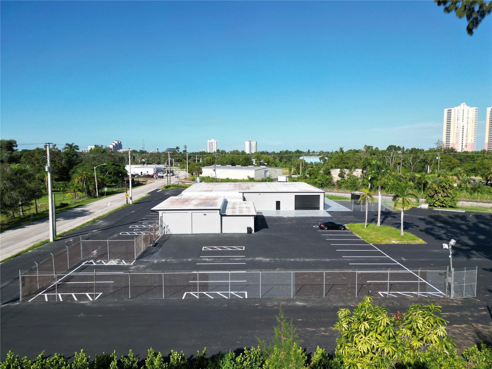 Welcome to 2931 Michigan Avenue in Fort Myers, Florida, a remarkable commercial-intensive zoned property, boasting 2.4 acres of prime real estate. This meticulously renovated gem encompasses an 8,160+/- square foot warehouse space and a newly built, thoughtfully designed 3,239+/- square foot office space. This property underwent a comprehensive transformation within the last year, resulting in a modern and highly functional facility.


Warehouse Space:

A spacious 8,160+/- square foot warehouse offers endless possibilities for your business operations.
Recent renovation included a complete reroof, ensuring structural integrity and durability.
Closed-cell insulation beneath the entire roof enhances energy efficiency and climate control.
Office Space:

A stunning 3,239+/- square foot office space that has been entirely revamped to spec, with high-end finishes and fixtures, providing a comfortable and professional working environment.
The upgrade includes all-new electrical, plumbing, and HVAC systems, ensuring a smooth and efficient workspace.
Every detail has been considered, from new interior finishes to custom lighting and contemporary design.
Exterior:

The property's exterior received an impressive facelift, with a new stucco finish adorning the entire building, creating an attractive and modern aesthetic.
A fresh coat of paint enhances the building's curb appeal, making it a standout in the neighborhood.
All exterior doors have been replaced, boosting security and energy efficiency.
Parking and Landscaping:

The parking lot has been resurfaced, providing ample parking spaces for your clients and employees.
Landscaping and sod have been meticulously redone, presenting a welcoming atmosphere.
Utilities and Infrastructure:

A new water main line and city hookup ensures a reliable and uninterrupted water supply.
The electrical supply line has been upgraded to 800 amps, accommodating the needs of modern businesses.
Security and Accessibility:

The property boasts a securely fenced rear portion, ensuring the safety of your assets and operations.
A new overhead door has been installed within the warehouse for added convenience.
This property is currently a lucrative asset, with a long-term tenant in place on a Triple Net (NNN) lease, making it an excellent investment opportunity. Located in the bustling city of Fort Myers, the property's convenience is unmatched, offering easy access to major highways, commercial centers, and local amenities.

The extensive renovations, with an investment of over $840,000, make this property a turnkey solution for businesses seeking a modern and efficient workspace. Moreover, the long-term value appreciation of both the warehouse and office space is primed to capitalize on the robust commercial real estate market, making this an astute choice for investors and business owners alike.

Don't miss the chance to secure this incredible property at 2931 Michigan Avenue, Fort Myers, Florida, where modernity, functionality, and long-term value converge. Contact us today to schedule a viewing and explore the endless possibilities this property has to offer. Please note that all measurements are approximate.