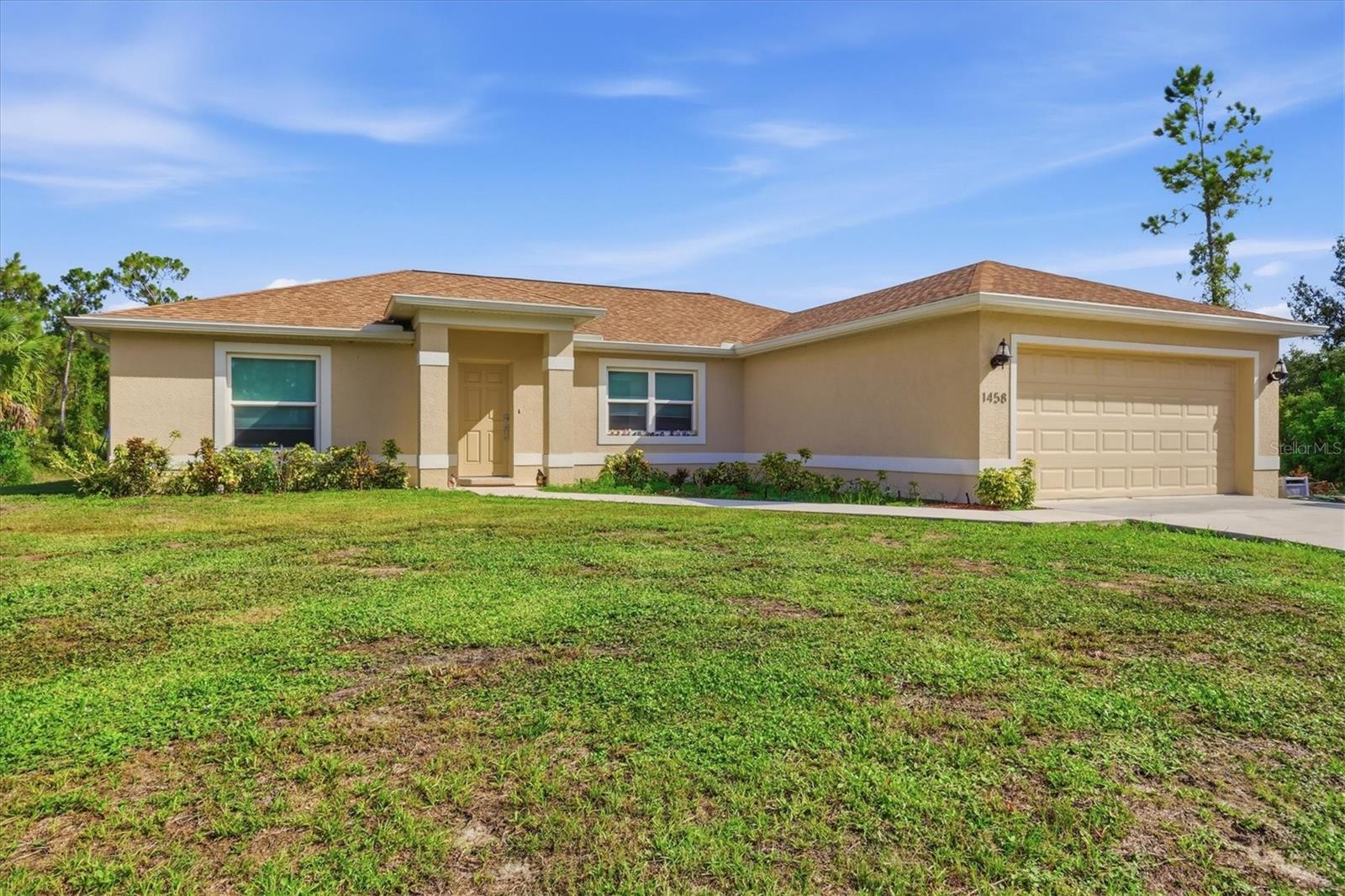 Located less than five minutes from I-75, this home offers the perfect combination of convenience and peaceful living, making it an excellent choice for commuters or anyone relocating to Southwest Florida. Built with quality and efficiency in mind, it features hurricane-impact, insulated Low-E windows, 30-year architectural shingles, and thoughtful upgrades throughout. The stylish kitchen and bathrooms showcase granite countertops, full-overlay cabinetry, and stainless-steel appliances, while a whole-home water filtration system adds everyday comfort.

The open-concept living and dining areas are highlighted by soaring vaulted ceilings and a spacious granite island that's perfect for gathering with family and friends. The private primary suite offers a walk-in closet and a beautifully appointed en-suite bath with dual vanities, a dedicated makeup area, and a walk-in shower with built-in seating and shelving. Sliding glass doors lead to the screened lanai, creating an ideal space for outdoor entertaining or relaxing while overlooking the oversized, fully landscaped yard with a 3-zone irrigation system. A spacious two-car garage completes the home's thoughtful design.

Enjoy the tranquility of a quiet country setting without sacrificing convenience. You'll be just minutes from shopping, restaurants, schools, public boat ramps, Gulf Coast beaches, spring training baseball stadiums, and Punta Gorda Airport. This move-in-ready home offers the perfect blend of comfort, quality, and location—schedule your private showing today!