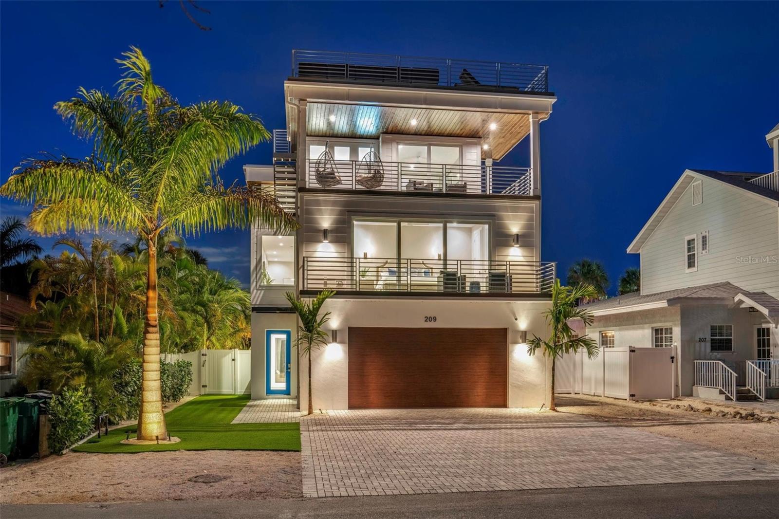Welcome to your dream beach oasis nestled on quiet Elm Ave just 7 houses away from the pristine Gulf of Mexico beaches and one block away from Pine Avenue!!  This stunning BRAND NEW construction is meticulously crafted with attention to detail and quality finishes throughout.  With 4 large balconies AND a roof top, you will never want to leave!  Boasting a spacious layout with four bedrooms and five and a half bathrooms, this immaculate home you are immediately greeted by an ambiance of elegance and comfort, blending seamlessly with the coastal charm of Anna Maria Island.  The open floor plan is designed for both relaxation and entertainment, featuring living/dining/kitchen that flows effortlessly and includes many outdoor balconies for that indoor/outdoor feel.  Prepare culinary delights in the chef's kitchen, equipped with stainless steel appliances, sleek quartz  countertops, and ample storage space.  The primary bedroom has luxurious finishes including light fixtures and an ensuite bathroom and 2 closets. The front balcony off the primary bedroom has gulf views, perfect to have your morning coffee and a gulf breeze.  The 4 additional well-appointed bedrooms offer comfort and privacy for family and guests, each thoughtfully designed with modern conveniences and stylish touches. Lounge on either the upper or lower spacious back patios, views of the pool and soak up the sun.  The most amazing part is the rooftop deck that has breathtaking panoramic views of the Gulf, providing the perfect backdrop for sunset cocktails or stargazing under the night sky.  Take a refreshing dip in the heated pool, surrounded by lush landscaping and tropical foliage and enjoy the turf with put put golf!   Enjoy the covered area so you don’t get too much of the hot Florida sun and play ping pong or hang by the outdoor bar with a TV!  Located in the heart of Anna Maria Island, this exceptional property offers the ultimate coastal lifestyle, with the nearby Gulf beaches, charming boutiques and restaurants on Pine Ave, its the best of both worlds!  Whether you're seeking a year-round residence or a luxurious vacation rental investment, this presents a rare opportunity to experience the best of island living in one of Florida's most desirable destinations.  Don't miss your chance to own a piece of paradise – schedule your private showing today and discover all that this magnificent home has to offer!