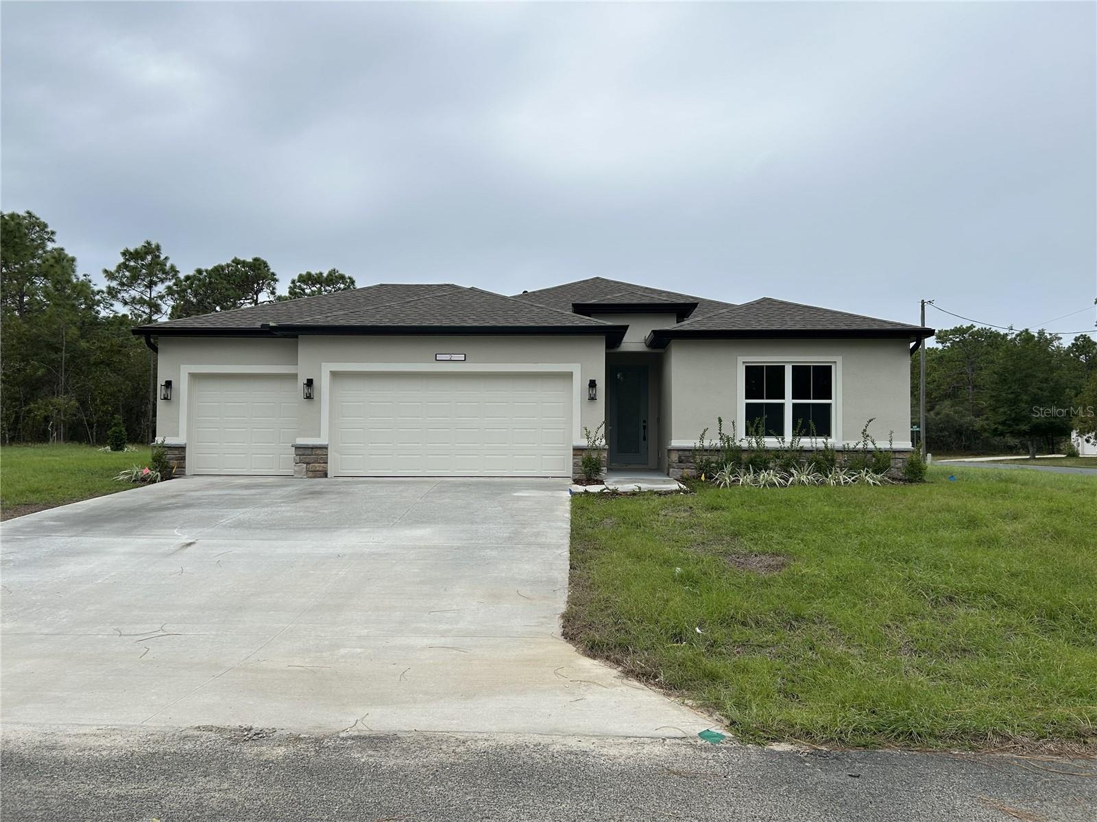 Pre-Construction. To be built. This 4-bedroom, 3-bath home, 3-car garage—offers a wide-open floor plan filled with natural light and enhanced by soaring high ceilings. The large primary suite is a true retreat, featuring dual walk-in closets for exceptional storage and comfort. A welcoming covered entry and a spacious lanai extend your living space outdoors, perfect for enjoying Florida’s warm breezes. Designed with craftsmanship you can see and quality you can feel, this home blends style, functionality, and lasting value.