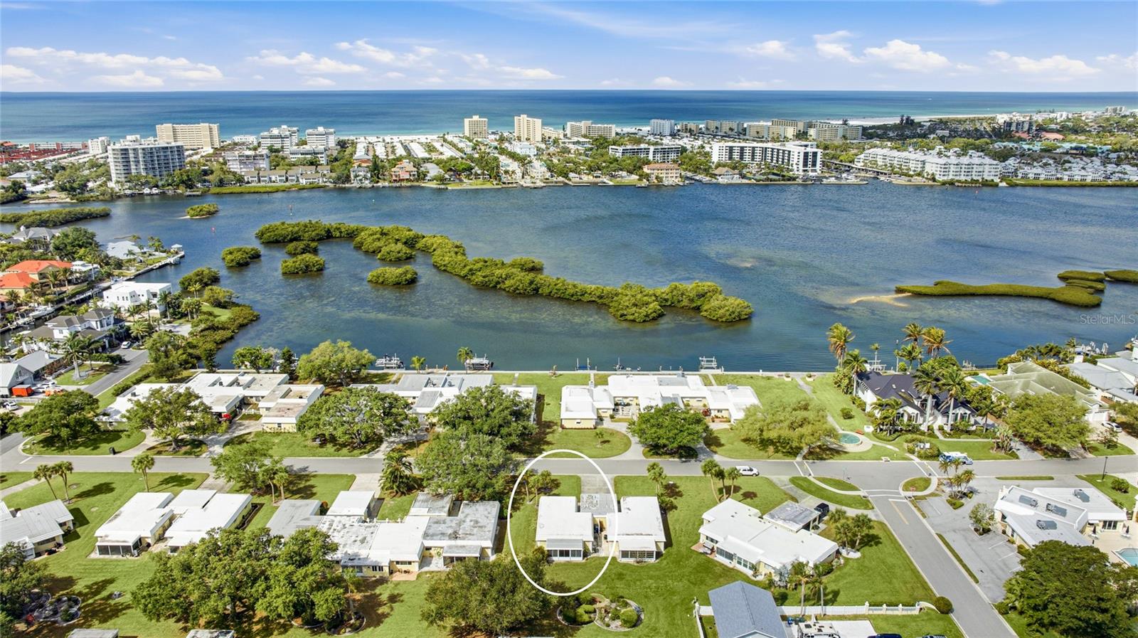 Virtually Staged. Completely renovated and ideally located in the waterfront community of Baywood Colony, this beautifully updated villa offers the perfect blend of modern comfort and coastal lifestyle. Just one block from Little Sarasota Bay and only moments to Siesta Key, this home places you right where you want to be. Inside, the updates shine from the moment you walk in. The open living and dining areas feel bright and welcoming, enhanced by new flooring and a warm wood-paneled ceiling that adds character and charm. Large sliding glass doors lead to the enclosed lanai, creating a seamless indoor-outdoor flow and offering a versatile space to relax or entertain. The kitchen has been fully renovated with new cabinetry, countertops, and stainless steel appliances, delivering a clean, modern look with functional design. Both bathrooms have also been beautifully updated, and new hurricane impact windows in the main living areas provide added peace of mind along with energy efficiency. The layout offers two comfortable bedrooms, including a spacious primary suite with its own private bath. The second bedroom is well-positioned for guests or flexible use as a home office. Step outside and enjoy the community’s true highlight—direct access to Little Sarasota Bay, where residents can take in stunning water views, launch a kayak, or simply relax by the water. Baywood Colony also features a heated community pool and well-maintained grounds, creating a laid-back, coastal atmosphere. Whether you're looking for a full-time residence or a seasonal retreat, this move-in ready villa combines thoughtful updates, a functional layout, and an unbeatable location near Siesta Key, dining, and shopping. **THIS PROPERTY QUALIFIES FOR A 1% LENDER INCENTIVE IF USING PREFERRED LENDER. INQUIRE FOR MORE DETAILS.**