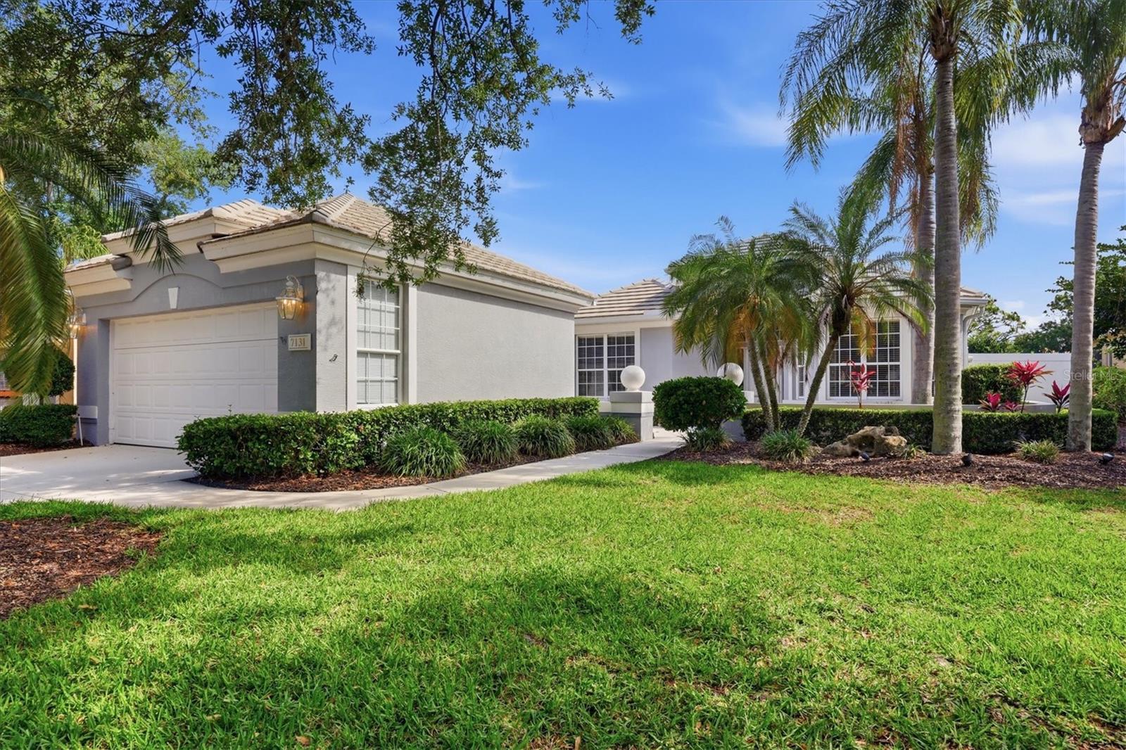Behind the gates of the sought-after University Park Country Club community, this beautifully maintained two-bedroom, two-bath residence with a private office offers the perfect blend of comfort, elegance and serene Florida living. Positioned to capture tranquil water and conservation views, the home welcomes you with mature landscaping, a charming front entrance courtyard and an inviting sense of privacy from the moment you arrive. Inside, spacious living areas are enhanced by soaring ceilings, abundant natural light and an effortless flow designed for both everyday living and entertaining. The formal dining room opens into a warm and inviting great room featuring an electric fireplace and sliding glass doors that seamlessly extend the living space to the expansive screened lanai overlooking peaceful natural surroundings. The well-appointed kitchen is both stylish and functional, showcasing sleek black granite countertops, a mosaic tile backsplash, warm natural wood cabinetry and a cozy breakfast area with sliding glass doors leading to a private grilling patio. The oversized primary suite serves as a private retreat, complete with dual walk-in closets and a spacious master bath featuring a soaking tub, glass-enclosed shower and private sliding glass door access to the lanai. A generously sized guest bedroom and provide flexibility for visitors, working from home or additional living space. The two-car garage adds convenience, while the neighborhood pool is just a few homes away. Beyond the home itself, residents enjoy the exceptional lifestyle offered within University Park Country Club, an award-winning gated community with 27 holes of four-star rated golf, 11 lighted Har-Tru tennis courts, pickleball, croquet, a state-of-the-art fitness center and first-class dining. A vibrant social calendar and numerous clubs create an active and connected community atmosphere. Ideally just minutes from The Mall at University Town Center and approximately four miles from downtown Sarasota, this home offers convenient access to world-class dining, shopping, museums, theaters, healthcare and cultural attractions. Renowned Gulf Coast beaches, Nathan Benderson Park, The John and Mable Ringling Museum of Art, boating and St. Armands Circle are all just a short drive away. This exceptional residence presents a rare opportunity to enjoy luxury living in a peaceful, private setting while remaining close to everything the Sarasota area has to offer.