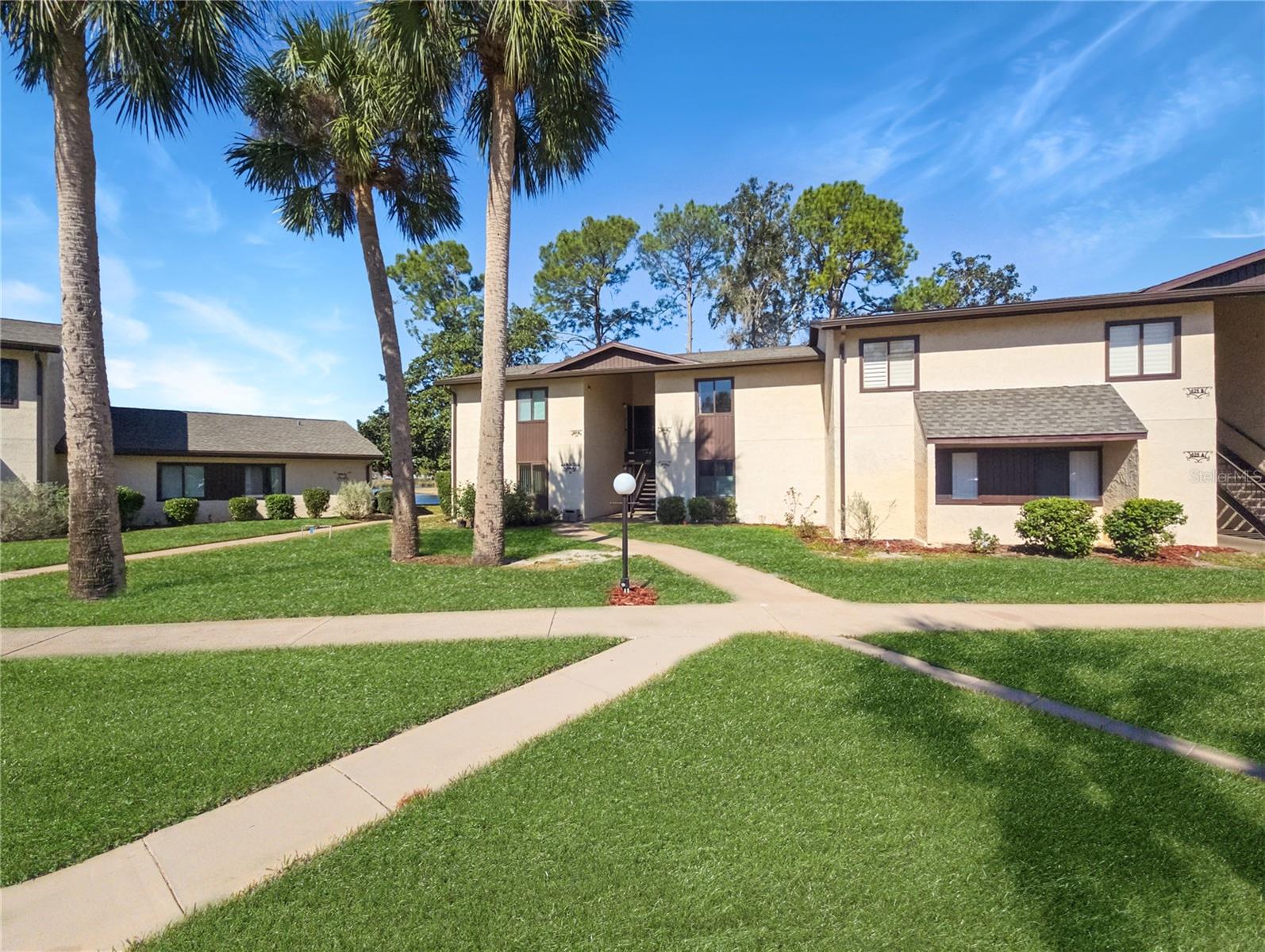 Welcome Home to this completely updated condominium, located in the highly sought after 55+ community of Lake Village West. This partially furnished, 1/1 plus a Flex room features luxury plank vinyl flooring throughout, spacious bath, beautiful electric Fireplace. The flex room can be used as an office, bedroom (murphy bed included) or a dining room. The kitchen counter is conditioned butcher block. Plenty of storage and a NEW HVAC. Enjoy your morning coffee or an evening beverage while you admire your beautiful view of Lake Sparkle from your private enclosed Lanai. You will enjoy the Oak lined streets, the community pool and several lakes nestled between the Silver Springs Country Club Golf Course. Only minutes from Walmart, Publix and other grocery stores, pharmacies, local restaurants, and hiking trails. You are also located 1 mile from the Silver Springs Community Center offering 3 pools, Jacuzzi, Pickleball & Fitness Center.