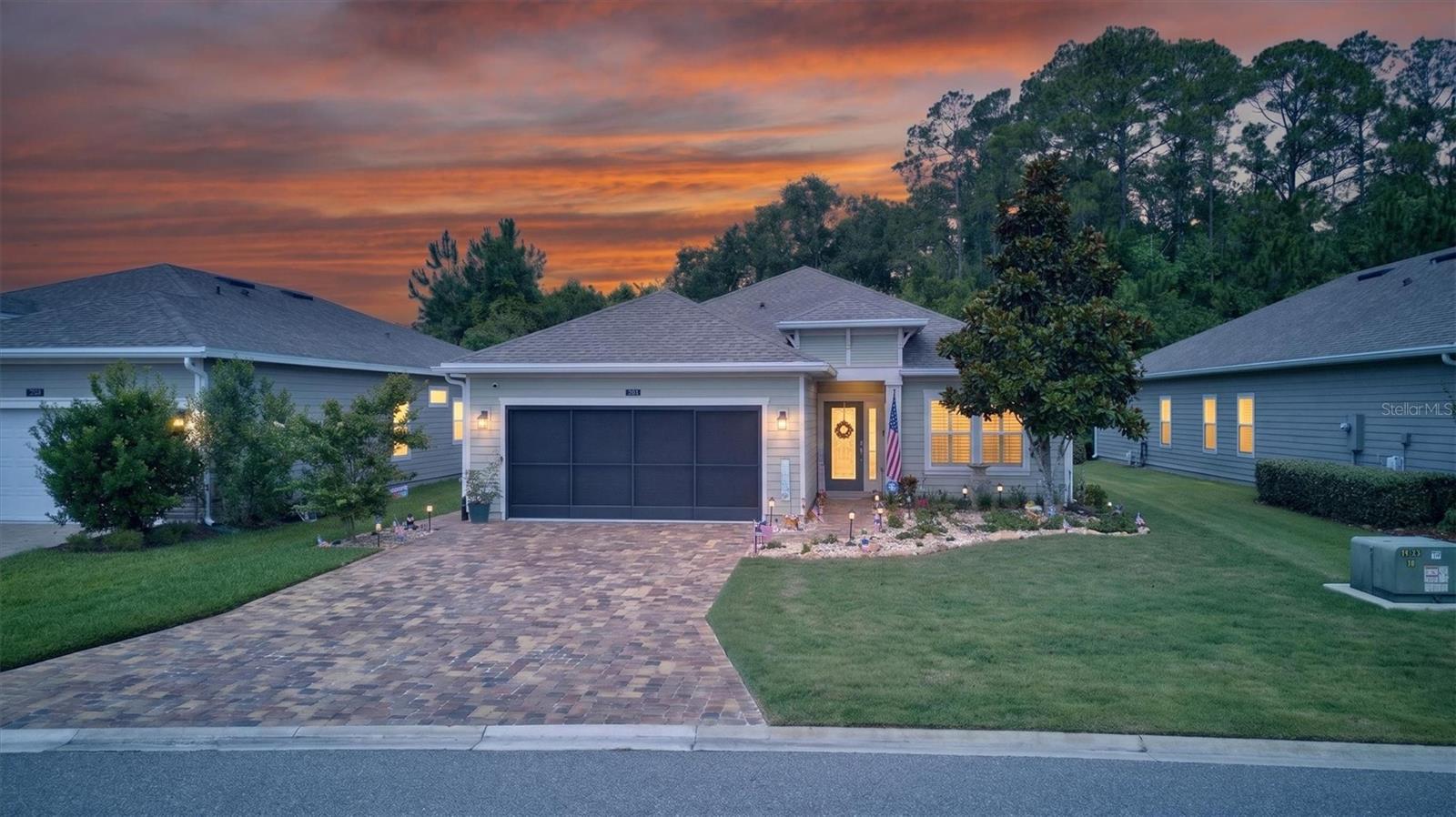 Located in the highly sought-after community of Windward Ranch, this immaculate residence showcases elevated design, thoughtful upgrades, and true pride of ownership throughout. Every detail has been carefully curated, creating a home that feels both refined and effortlessly livable.

Set on a premium homesite backing to a tranquil preserve, the property offers exceptional privacy along with beautifully enhanced landscaping completed in 2025 across the front, side, and rear yards. The fully fenced backyard creates a serene outdoor retreat, further enhanced by integrated Govee exterior lighting that wraps the home, creating a stunning evening ambiance.

A striking etched glass front entry door sets the tone from the moment you arrive, offering both elegance and natural light. The home also features keyless entry and a comprehensive security system for modern convenience and peace of mind.

Inside, the home is completely carpet-free, featuring wood-look tile flooring throughout every room, including all bedrooms, delivering a seamless, modern aesthetic and easy maintenance. Plantation shutters throughout, crown molding in every room, upgraded modern light fixtures and ceiling fans, and a cohesive design palette elevate the home’s elevated feel.

The main living area opens to an enclosed lanai with sliding windows that move left to right, creating a flexible indoor-outdoor living space ideal for year-round enjoyment. The living room slider is also equipped with an electric retractable screen, allowing fresh air to flow through the home with ease while maintaining comfort and functionality.

The kitchen features a gas range, custom pantry shelving, and updated countertops in both the kitchen and bathrooms, offering a fresh, contemporary look that goes beyond standard builder finishes.

The primary suite includes a custom-designed closet, while the laundry room is outfitted with built-in cabinetry and a utility sink for added convenience. Additional enhancements include epoxy-coated garage flooring and an electric roll-up garage screen door, allowing natural light and airflow into the garage space.

Major system and feature upgrades include appliances replaced in 2024 and the installation of a water softener, adding both value and peace of mind.

Residents of Windward Ranch enjoy resort-style amenities including a community pool, clubhouse, fitness center, pickleball courts, basketball courts, playgrounds, and mini golf—offering a vibrant lifestyle in one of St. Augustine’s most desirable neighborhoods.

This is a rare opportunity to own a meticulously upgraded home where no detail has been overlooked, blending luxury, comfort, and modern smart-home living in perfect harmony.