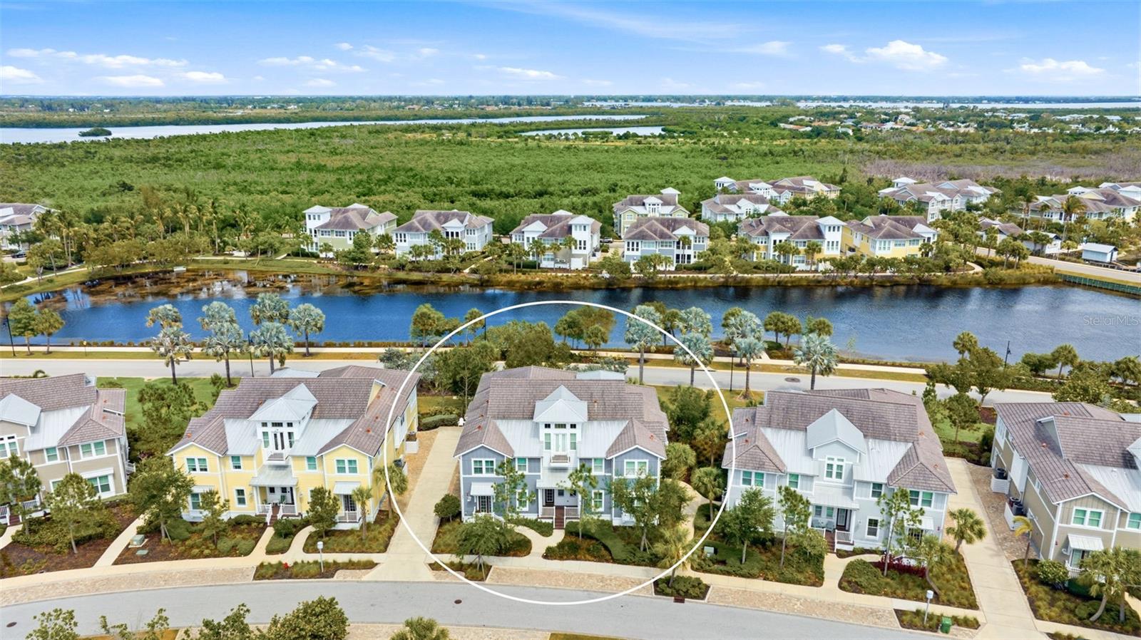 Live the coastal lifestyle you’ve been dreaming of in the gated, resort-style community of Harbour Isle. Begin each day in your light-filled sunroom, sipping coffee as the sun rises over the tranquil lagoon. This beautifully maintained Bermuda floor plan coach home offers 2 bedrooms plus a versatile den (currently used as a third bedroom) and 2 full baths, all thoughtfully designed with upscale finishes throughout. From plantation shutters and French doors to the vaulted, beamed ceiling, shiplap accents, tray ceilings, crown molding, solid core doors, built-in closets and the private elevator-every detail adds functionality and charm. The kitchen is both stylish and functional, featuring wood cabinetry, stainless steel appliances, granite countertops, a walk-in pantry, and a large island with breakfast bar-perfect for entertaining. Retreat to the spacious owner’s suite with dual vanities, shower, and walk-in closet. The oversized side-load 2-car garage with extra closet storage has space for all your beach essentials. Built with efficiency and durability in mind, this LEED-certified home includes PGT impact-rated windows and quality construction throughout. Explore miles of neighborhood paths and find an inviting hammock for an afternoon siesta. The home is conveniently located right across the street from one of the community pools which makes it so easy to enjoy a refreshing swim or an afternoon of lounging in the sunshine. Or check out one of the 3 additional pools in the community, each with their own special features. End your day with an incredible sunset at the amazing 23,000 sq ft Beach Club over-looking Anna Maria Sound, the crown jewel of the community. The Beach Club features resort-style amenities with resort pool and hot tub, the Sky Bar, Lounge, restaurant, state-of the-art fitness center, yoga lawn, event lawn and private beach where you can launch your kayak in the Sound. Just over the bridge, Anna Maria Island awaits with its sugar-sand and laid-back charm. What are you waiting for? It’s time to start living your best life in Harbour Isle!