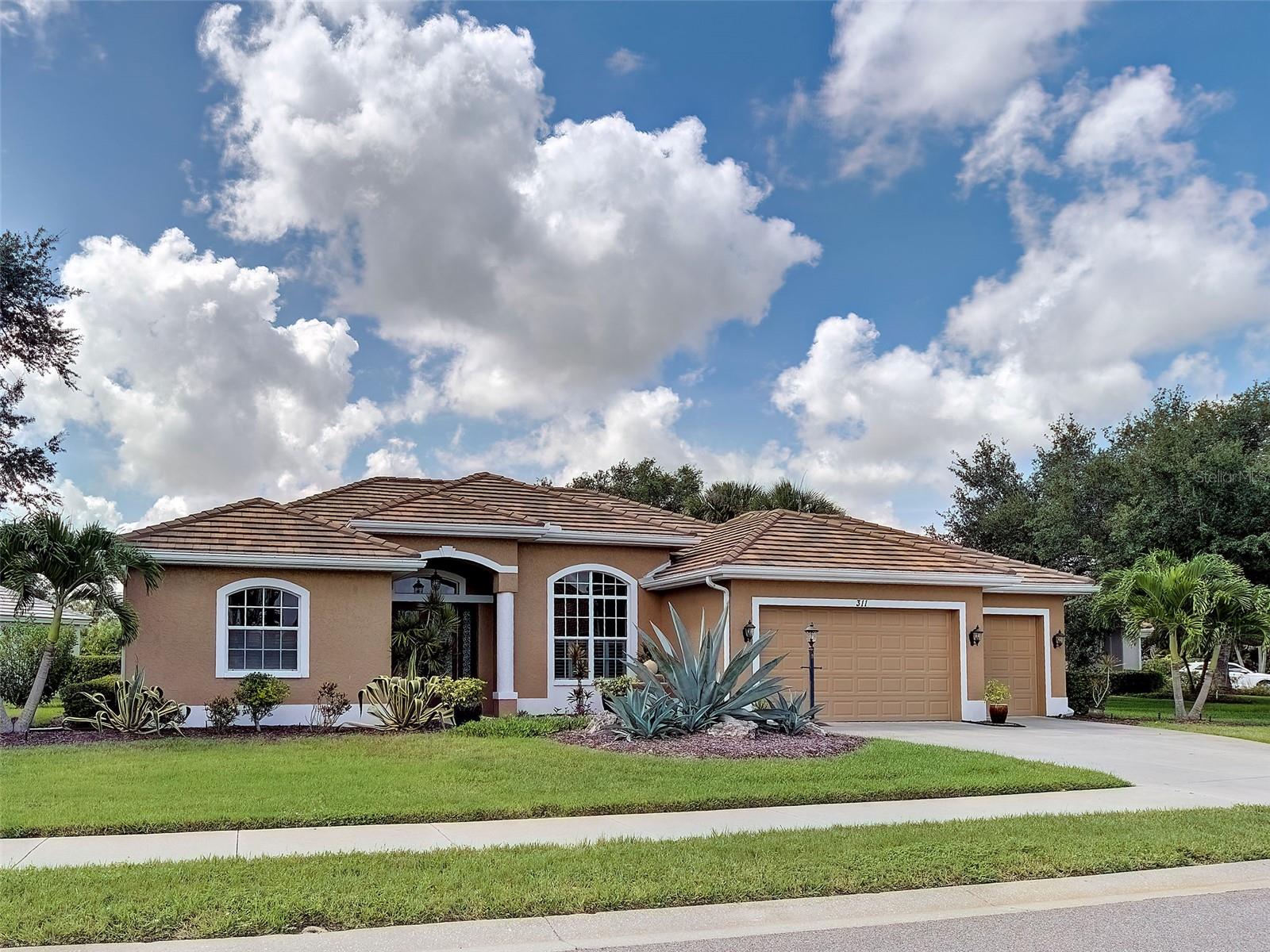 Your piece of paradise awaits in the highly sought-after gated community of The Venice Golf & Country Club! Perfectly positioned on a tranquil lake, this beautifully maintained home offers the ideal blend of comfort, space, and Florida living. This spacious home features three bedrooms, three bathrooms, a family room, formal living room and formal dining room, providing flexible living and entertaining space for both everyday living and hosting guests. The open kitchen serves as the heart of the home featuring a granite waterfall, spacious island, wood vanilla glazed cabinets, under cabinet lighting, breakfast bar, and a dining nook that overlooks the pool and peaceful water views. The open-concept great room/ family room is designed for easy living and effortless entertainment, anchored by a gourmet kitchen that is every chef's dream.  Recent updates provide peace of mind, including new kitchen appliances, New Roof (2022), New AC (2017), plank style tile floors in the bedrooms. Step outside to your private outdoor retreat where the screened lanai overlooks the pool and serene lake. The spacious primary suite is both inviting and refined showcasing a tray ceiling, office or sitting area overlooking the pool, the en-suite bathroom offers a soaking tub and walk-in shower for a true spa-like retreat, large walk-in closets. A split-bedroom layout placed two generously sized guest suites on the opposite side of the home, providing privacy for family and guests, with a full size bathroom. A separate laundry room makes laundry day "loads of fun". 
Meticulously maintained and move in ready the property also offers, custom window treatments, plantation shutters, custom lighting, pool w/fountain, 3 car garage perfect for your golf cart or additional storage.  The Venice Golf and Country Club truly one of a kind is member owned, features a spacious bar, gourmet kitchen and beautiful restaurant for members to enjoy event dinners throughout the year. The state-of-the-art wellness center offers fitness classes, yoga, massage therapy, physical therapy and personal training. The beautifully renovated Ted McAnlis designed 10-hole championship golf course is rated as one of the best and well-maintained golf course in the region. Residents also enjoy Har-Tru tennis courts, bocce ball and a junior Olympic-sized pool and spa. A Geo-Certified Audubon Cooperative Sanctuary, VGCC embraces environmental stewardship. 
Whether you seek an active lifestyle or tranquil surroundings The Venice Golf & Country Club  delivers both in unmatched community setting. Just minutes away from historic downtown Venice, with its charming boutiques, diverse dining, cultural events and true small-town coastal atmosphere. Multiple Gulf beaches are minutes away, offering pristine sands, shelling opportunities and breathtaking sunsets. Nearby Wellen Park adds further appeal with its outdoor events, restaurants, shopping, entertainment and Atlanta Braves Stadium.
This home combines leisure, location and an exceptional opportunity to live in Venice Golf & Country Club, one of Venice's premier golf communities. Don't miss your chance to own this beautiful home. Make a private showing appointment today !