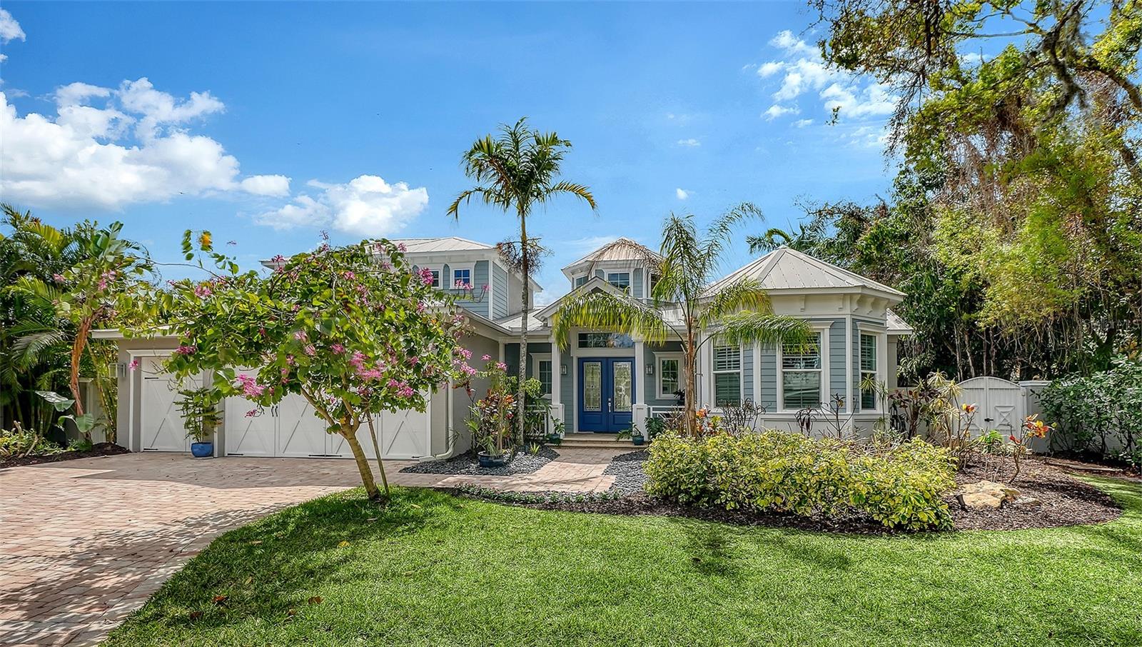 Find your sanctuary in this exquisite Allegra custom home, ideally located on one of the few non-throughfare streets in the highly coveted West of the Trail neighborhood. Serene and understated from the outside, the home opens to a breathtaking entry that reveals an extraordinary Great Room featuring soaring 21-foot beamed ceilings, a dramatic windowed rotunda, and an open-concept design bathed in natural light. Oversized 10-foot doors frame every room, while hurricane-impact sliding glass doors seamlessly connect the interior to a resort-style outdoor oasis. The expansive pool deck showcases a stunning lighted fountain spilling from the spa into the oversized pool, a rainfall pergola, and lush tropical landscaping surrounded by a six-foot privacy fence—creating the ultimate setting for both relaxation and entertaining. Built with the signature craftsmanship of Allegra Homes, the residence features exceptional custom millwork, striking feature walls, designer lighting, and distinctive ceiling details throughout. Spanning 3,582 square feet, this thoughtfully designed home offers four spacious bedrooms, three luxurious bathrooms, a private den/office with a turret ceiling, and a versatile bonus room. The gourmet kitchen—one of Allegra’s most beloved layouts—is a true culinary showpiece, appointed with Sub-Zero and Wolf professional-series stainless steel appliances, including a five-burner natural gas cooktop, a second Sub-Zero beverage refrigerator, custom luxury cabinetry, rich 3cm granite countertops, and a glass tile backsplash with hidden electrical outlets Adjacent to the kitchen, the elegant dining room features a dramatic aquarium glass window overlooking the pool and gardens, along with a built-in buffet accented by a mirrored feature wall. The home’s split floor plan provides exceptional privacy. The serene primary suite is a private retreat, offering a spa-inspired bath with a walk-through shower, dual vanities, and a private water closet. A custom walk-in closet features built-in shelving, drawers, and a hallway dressing mirror. The bedroom is highlighted by an intricate custom ceiling design, designer lighting, and private access to the pool deck. On the opposite side of the first floor, you’ll find a built-in desk alcove, a spacious laundry room, a secondary bedroom with a walk-in closet, a full hall bath, and the bonus room with disappearing sliding glass doors that open to the screened pool area. The first level features rich porcelain wood-style flooring, while the second level is comfortably carpeted and hosts the third and fourth bedrooms, along with a media closet and additional HVAC storage. Bahama shutters and custom blinds complete the bedrooms and bathrooms. Situated on a 0.28-acre elevated lot, built above the flood plain in 2015, this exceptional residence offers privacy, luxury, and an unbeatable central location. Just minutes away are Sarasota Memorial Hospital, Southside Village, and top-rated Southside Elementary, with Siesta Key Beach, downtown Sarasota, Westfield Siesta Key Mall, and St. Armands Circle only a short drive away. This remarkable property may be purchased turnkey furnished, including original artwork, bronze sculptures, designer furnishings, and custom rugs, available under a separate bill of sale. Schedule your private showing today. Proof of funds required with all offers.