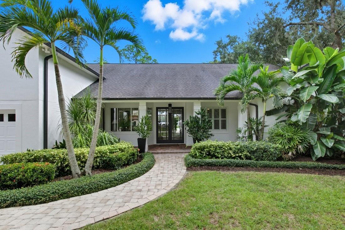 One or more photo(s) has been virtually staged. Welcome to a rare expression of Florida luxury where pristine waterfront, private acreage, and elevated design come together to create a lifestyle few properties can offer. Set behind a gated entrance on nearly six private acres with over 220 feet of shoreline on spring-fed Lake Pickett, this eloquently renovated estate invites you to experience every day like a private resort.
Wake to breathtaking lake views, launch your boat from your private dock with lift, spend afternoons skiing, paddleboarding, fishing, or simply enjoying the peaceful beauty of one of Central Florida's most sought-after private lakes. Beyond the shoreline, the property transforms into your own recreational retreat with open green space for ATVs, outdoor adventures, gardening, entertaining, or creating the ultimate family playground—all while remaining minutes from the conveniences of Orlando, Oviedo, Geneva and Chuluota. 
Inside, more than 4,000 square feet of thoughtfully redesigned living space showcases timeless finishes and effortless elegance. The chef's kitchen serves as the heart of the home with custom cabinetry, premium appliances, generous prep space, and expansive views of the pool and lake beyond. White oak-inspired ceramic flooring flows throughout the main living areas, while walls of glass invite natural light and stunning water views into nearly every room.
The private primary suite offers a true sanctuary with a spa-inspired bath, custom walk-in closet, and tranquil views that make every morning feel like a vacation. A flexible split-bedroom floor plan provides exceptional privacy for family and guests, while additional living spaces adapt seamlessly for a home office, fitness room, media lounge, or multigenerational living.
Outdoor living is where this estate truly shines. A resort-style heated pool and spa with sun shelf, retractable screened lanai, outdoor shower, lakeside gazebo, greenhouse, fruit trees, and beautifully lush grounds create endless opportunities for entertaining or relaxing in complete privacy. A detached garage and additional storage buildings provide abundant space for recreational equipment, boats, water toys, and hobbies.
Opportunities to own nearly six gated lakefront acres on one of Central Florida's premier private ski lakes are exceptionally rare. This is more than a family home—it's a destination where every season is boating season, every sunset becomes an event, and every day embraces the very best of the Florida lifestyle.