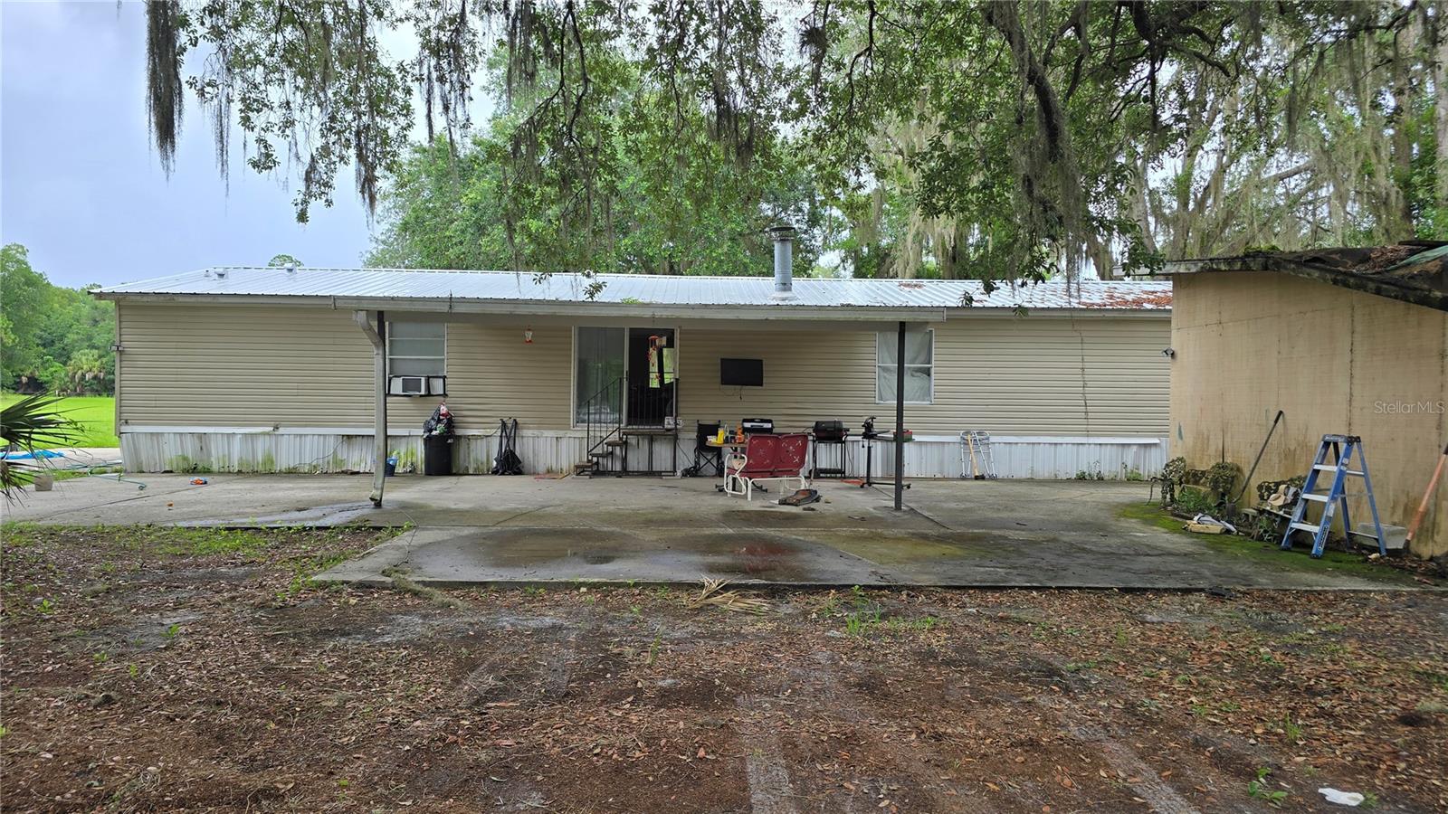 Opportunity awaits on this nearly 4-acre property offering privacy, peaceful surroundings, and plenty of room to grow. With only a few neighboring homes nearby and beautiful views of nature and a nearby pond, this is a rare chance to enjoy country living with space to spread out.

This 3-bedroom, 3-bath home offers nearly 2,000 square feet of living space and features a newer metal roof installed just a few years ago and a working central AC system that is approximately 10 years old. Inside, you'll find a spacious split-bedroom floor plan with a large kitchen offering abundant cabinet and counter space, room for both formal and casual dining, a wood-burning fireplace, and a huge indoor laundry room.

The oversized primary suite is one of the home's standout features, measuring approximately 26x14 and featuring a large 12x8 walk-in closet positioned between two private bathrooms. One bath includes a tub while the other features a walk-in shower.

The home does need TLC and repairs, including flooring, ceiling work, and other updates needed throughout. However, with solid square footage, desirable acreage, major roof improvements already completed, and a unique floor plan, this property presents an excellent opportunity for buyers looking to add value and make it their own. Contact us for more information or to schedule a showing.