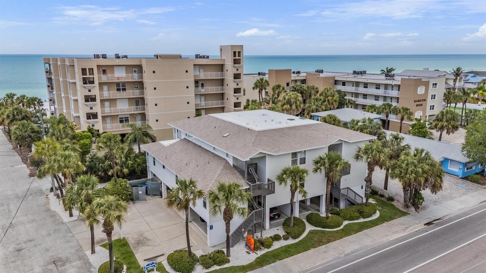 Have you been searching for a fully furnished, established beach condo with proven rental history? This stunning 2-bedroom, 2-bath top-floor unit in beautiful Indian Rocks Beach offers the perfect combination of investment potential and coastal living. A successful beach rental for years, this is an opportunity you won’t want to miss. Inside, the condo has been thoughtfully updated with brand new tiled showers, luxury vinyl plank flooring throughout, and an expansive family room designed for relaxing and entertaining. The spacious kitchen features abundant counter space, making meal prep and hosting effortless. One of the standout features of this rare unit is the abundance of natural light, thanks to windows throughout the condo, a detail not commonly found in many neighboring units. Step outside to the oversized balcony, the perfect place to enjoy your morning coffee or unwind with evening wine after a day at the beach. Additional highlights include two dedicated under-building parking spaces, a community pool, and direct beach access just steps from your door. No searching for parking, no hauling beach gear long distances, simply walk out and enjoy the sand and ocean whenever you like. Whether you’re looking for a vacation getaway, income producing property, or full time beach retreat, this condo truly has it all. Indian Rocks Beach is one of the Gulf Coast’s hidden gems, a laid-back beach town tucked between Clearwater and St. Pete Beach. Compared to the larger tourist-heavy beach towns nearby, IRB has a much quieter, more local feel with fewer high-rises, less traffic, and a more relaxed atmosphere. Locals and repeat visitors often describe it as “Old Florida” charm.