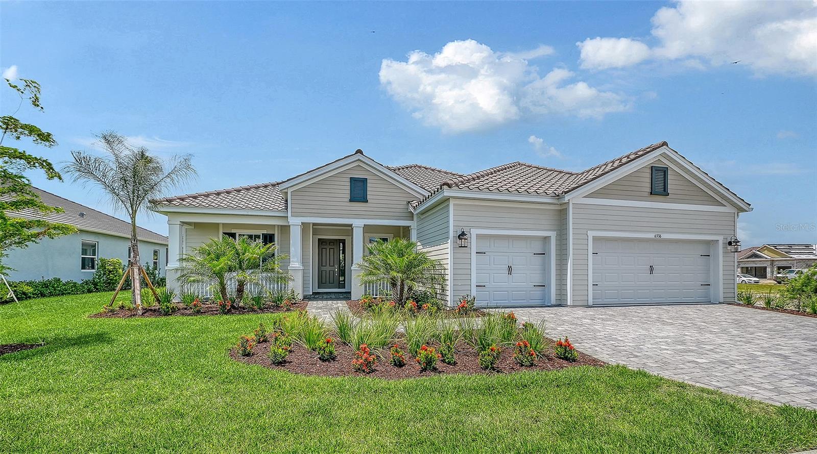 Under Construction. This stunning Island-elevation home offers a perfect blend of luxury, comfort, and Florida living. Step onto the welcoming front porch and into a spacious foyer that opens to an extra-long living room seamlessly connected to the dining area. Pocketed sliding doors lead to the lanai, where serene pond and preserve views create the ultimate backdrop for relaxing or entertaining. Enjoy the sparkling pool and spa surrounded by pavered decking for effortless indoor-outdoor living.

Inside, a club room with its own lanai access provides a versatile retreat, while the front den with French doors is ideal for a home office. The mudroom and utility space off the garage add everyday convenience. Guests will appreciate a private suite, and the primary bedroom features an impressive spa-style bath with a soaking tub.

Designed for gathering, the gourmet kitchen and outdoor living spaces are truly the heart of this home. This home truly must be seen to be believed.