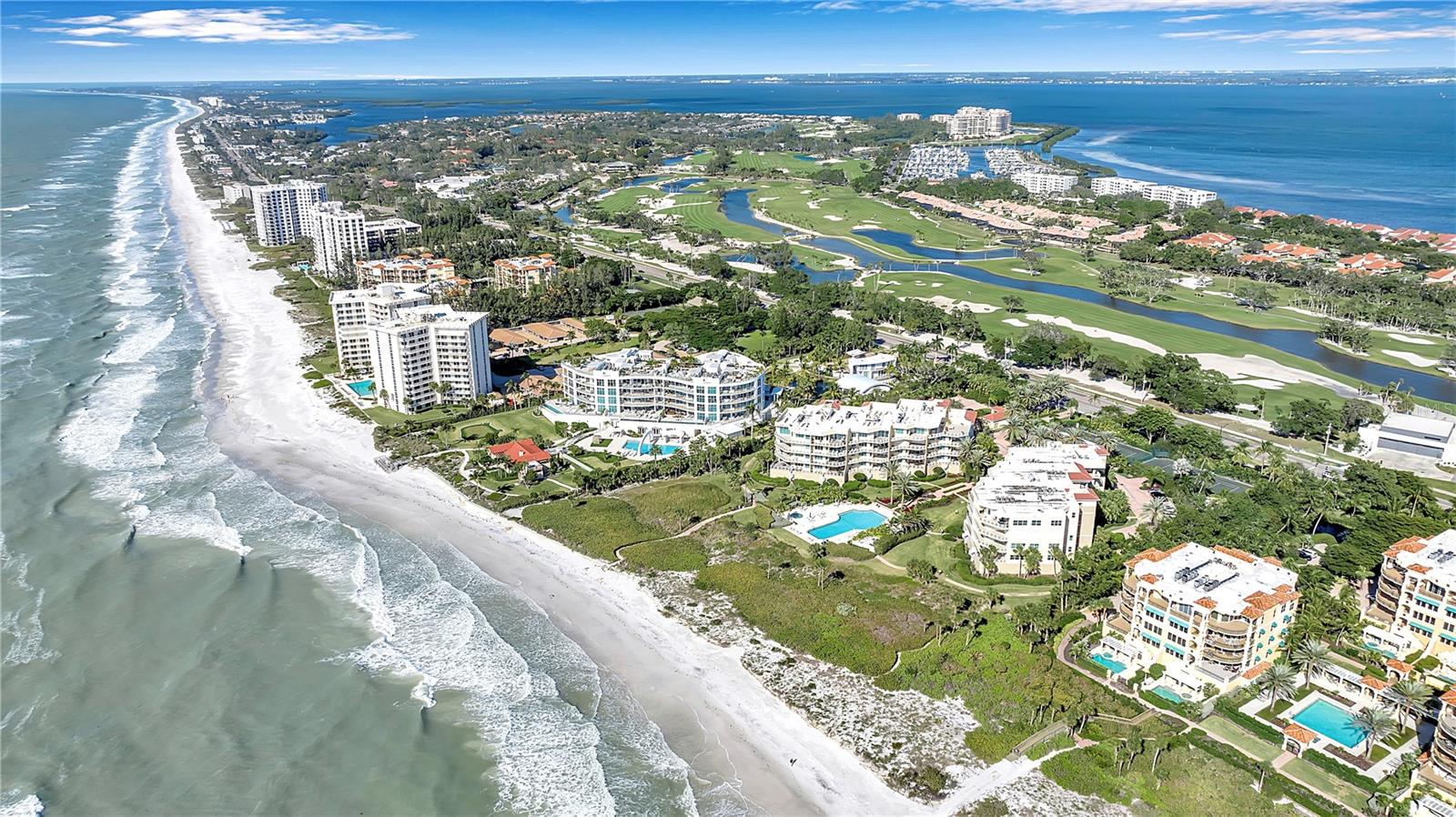 Experience and enjoy breathtaking, unobstructed Gulf views from this exceptional “walk-down” corner 3-bedroom 3-bath residence in the prestigious Villa Di Lancia community on South Longboat Key. Fully updated and spanning 2,485 sq. ft., this residence feels like its own private beachfront home. Upon entering from the semi-private elevator lobby, you are welcomed into an open and light-filled floor plan with soaring 10-foot ceilings and expansive walls of glass. As one of the most desirable corner residences in the community, this residence showcases panoramic Gulf views from nearly every room, which can be enjoyed by an additional wall of windows that flood the interior with natural light. The expansive great room connects to a nearly 500 sq. ft. covered terrace — your front-row seat to spectacular sunsets over turquoise waters! The terrace also has a private staircase allowing direct access to the beach and Gulf-front pool and spa, creating a rare and seamless indoor-outdoor lifestyle. The updated eat-in kitchen features a serving bar, walk-in pantry, full laundry room, and generous storage. The split floor plan allows owners and guests alike to enjoy quiet privacy. The primary suite is a true retreat, complete with direct Gulf views, private terrace access, spacious closets, and a large en-suite bath. The guest wing includes a second en-suite bedroom, as well as a third bedroom or a convenient and flexible den space with an adjacent bath. Villa Di Lancia is an exclusive boutique community with only 38 residences with resort-style amenities. Relax by the heated Gulf-front pool and spa, or enjoy friendly competition on the Har-Tru tennis and pickleball courts, as well as a state-of-the-art fitness center and steam room. Resort-style living has been effortlessly achieved throughout the community, including the newly updated clubhouse, social room and kitchen, on-site management, 24-hour manned gate, EV charging station, secure under-building parking, guest parking, and a private storage room. This welcoming community is both pet-friendly and impeccably maintained. Ideally located on the southern end of Longboat Key, residents enjoy proximity to fine and casual dining, golf, marinas, shopping, St. Armands Circle, and Sarasota’s cultural attractions. Residences here are rarely available. This is a rare opportunity to own a luxurious beachfront sanctuary and experience refined coastal living at its finest. This residence feels like a beautiful private home on the beach!