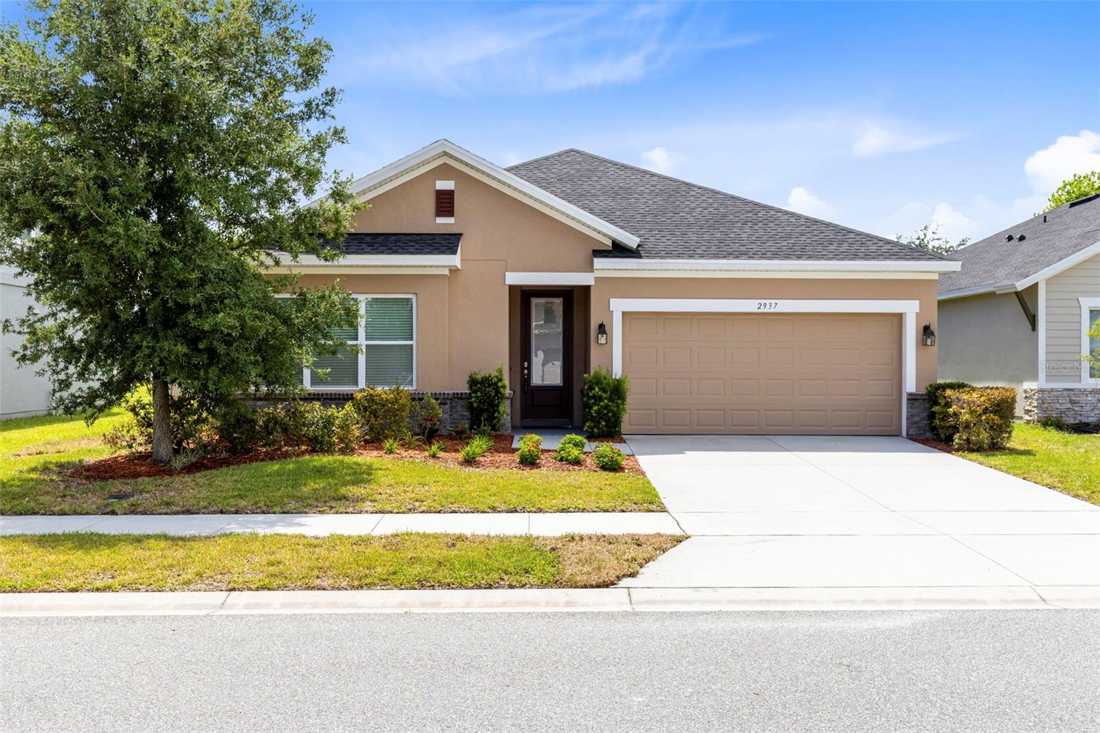 Welcome to 2937 Deerberry Lane where the seller is offering $10,000.00 towards buyers closing costs with an acceptable offer. This stunning David Weekly-built home, Catalyst floor plan is where modern elegance meets everyday comfort. Built in 2020, this meticulously maintained 4-bedroom, 3-bathroom residence offers 2,157 square feet of thoughtfully designed living space and an impressive list of upgrades that make it truly move-in ready. From the moment you arrive, you'll appreciate the home's fresh curb appeal, enhanced by a newly painted exterior, while the freshly painted interior creates a bright, clean, and inviting atmosphere throughout. At the heart of the home is a beautifully renovated chef's kitchen, designed to impress with stylish finishes such as BRAND-NEW cabinets, granite countertops, herringbone design tile backsplash, a premium DOUBLE GE Café oven and GE Café microwave in an abundance workspace—perfect for gatherings, entertaining guests, or preparing everyday meals with ease. The open-concept layout seamlessly connects the kitchen, dining, and living areas, creating a spacious and welcoming environment.  The generous owner's retreat serves as a private sanctuary, featuring a CUSTOM DESIGNED walk-in closet that combines luxury and functionality. Three additional bedrooms and two full bathrooms within a 3 WAY SPLIT FLOOR PLAN, provide plenty of space for family, guests, or a home office. One of the ADDITIONAL BEDROOMS features a PRIVATE BATHROOM.  Step outside to your FULLY FENCED BACKYARD, offering privacy and room to enjoy Florida's beautiful weather, whether you're hosting weekend barbecues, letting pets roam freely, or simply unwinding after a long day. The outdoor space has been further enhanced with a new patio featuring beautiful pavers with a foundation already footed for a future enclosure providing an excellent opportunity to create the ultimate outdoor living area. Additional upgrades include a whole home in wall pest control system, water softener, attic ladder for convenient storage access, and a radiant barrier in the attic designed to improve energy efficiency and comfort year-round. A full list of upgrades can be provided upon request. Serenoa Community is nestled among rolling hills and surrounded by natural beauty, offering a resort-style clubhouse with a large zero-entry pool, splash pad, state-of-the-art fitness center, scenic walking trails, and a dedicated dog park all for the residents to enjoy. HOA dues INCLUDE premium high-speed internet and cable along with the community being gated, providing exceptional value and convenience while creating the perfect balance of recreation and relaxation.