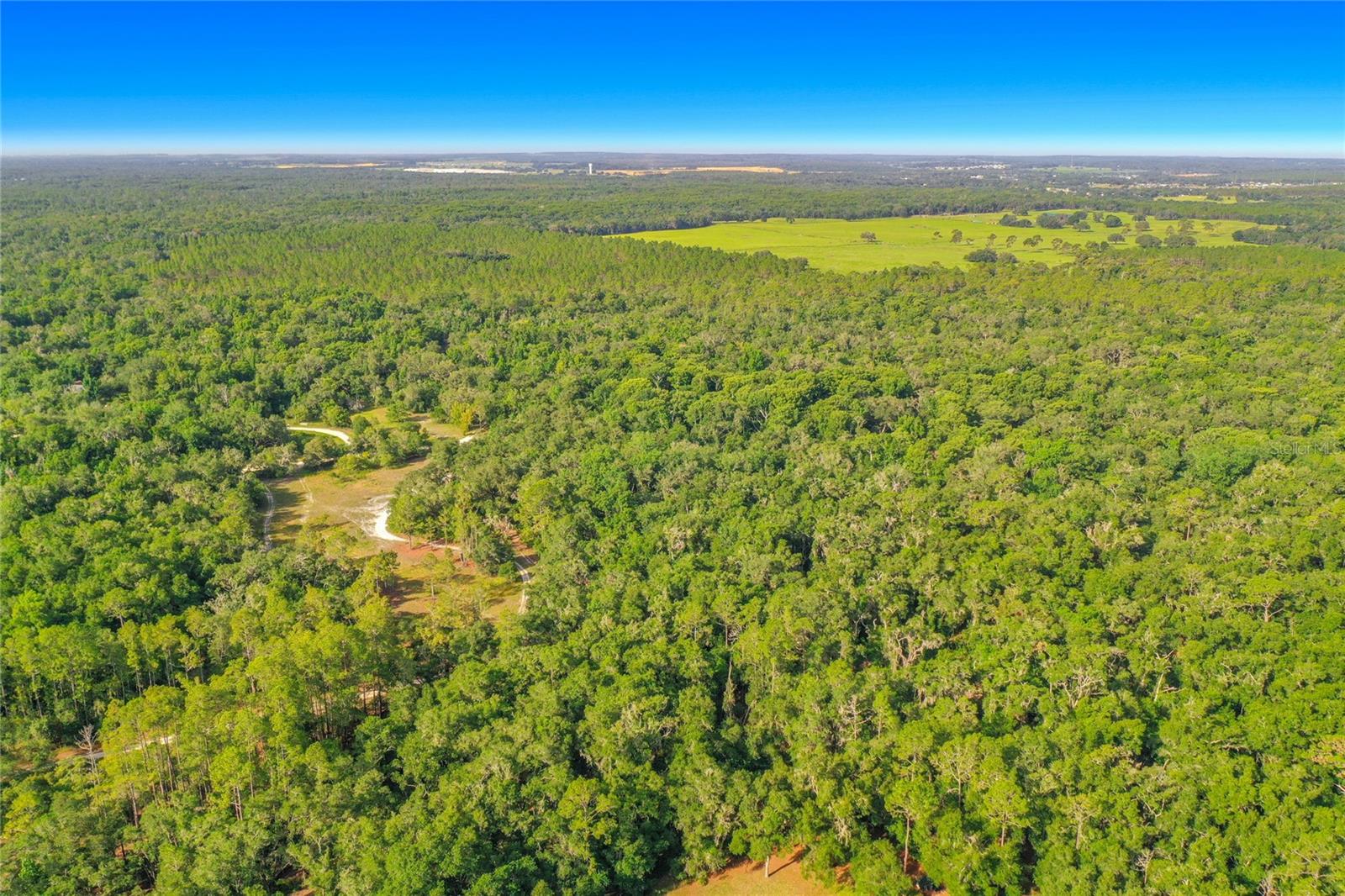 1.16-acre vacant lot located on Coral Rock Dr in Webster, FL. This wooded parcel offers plenty of space for a future homesite while maintaining a private, rural setting. Situated in Ridge Manor Estates, the property provides a balance of seclusion and convenience, with access to major roadways including US-301, SR-50, and I-75. No HOA. Whether you're looking to build, invest, or simply own a piece of Florida land, this property is worth a look. Buyer to perform their own due diligence regarding zoning, land use, utilities, access, and building requirements.