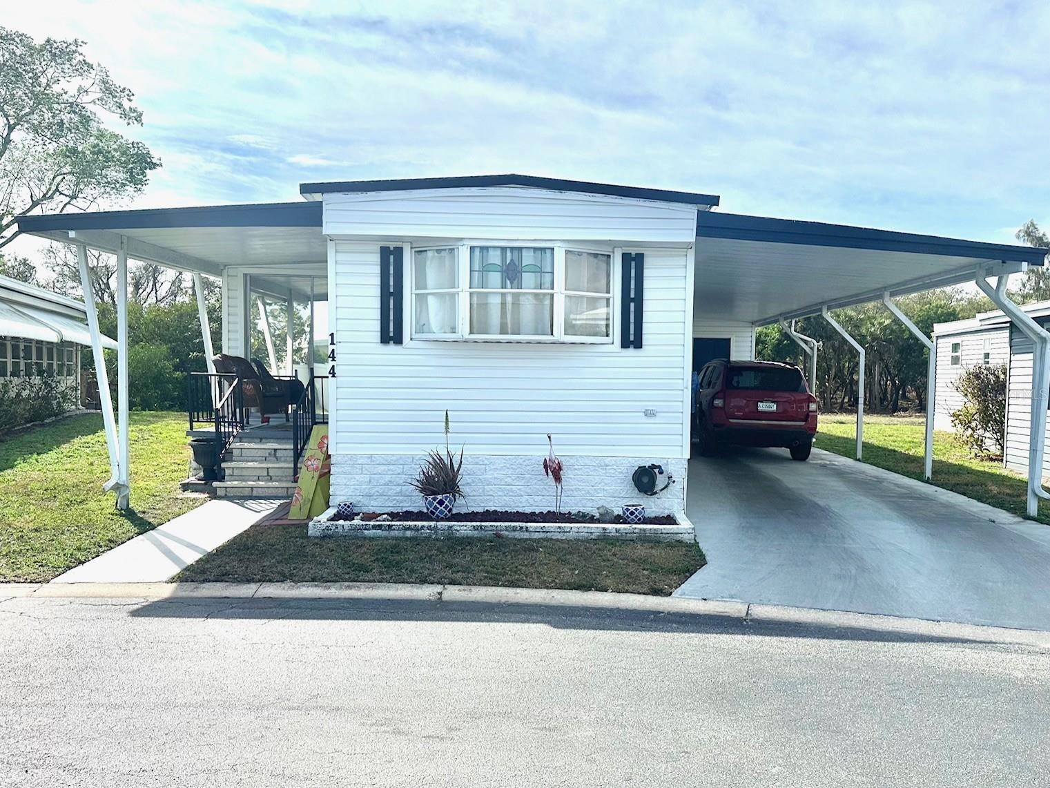 NEW PRICE! Do not wait to see this fantastic opportunity to live on the beautiful & peaceful waterfront of Clearwater Cascade! Bring your fishing gear & kayak, that will take you out to Tampa Bay! Come see this updated 950 sq. ft. 2 bedroom, 2 bath, split plan model, with relaxing back patio and private yard to enjoy! Luxury vinyl floors, newly updated Central Air/Heat Unit '21, with updated ductwork, new electric, and new vapor barrier under home! Easy care Vinyl Siding and Insulated Double Roof! Special Decorator fans to see! Inside Washer/Dryer on porch for your convenience! Lots of extra storage, and spacious workshop! Come see this 5 star, 55+, Fun & Active, Award Winning Resident Owned Park! See: Clearwater Cascade website for all the park pics & amenities! Only steps away from shopping, beaches, golf courses, medical, restaurants, airports, and all you would want! Cash only! NOW Asking $102,900., includes the $55k share! Low $352. mo. fee, covers your water, sewer, garbage, cable tv, internet, and much more! Small pet ok!