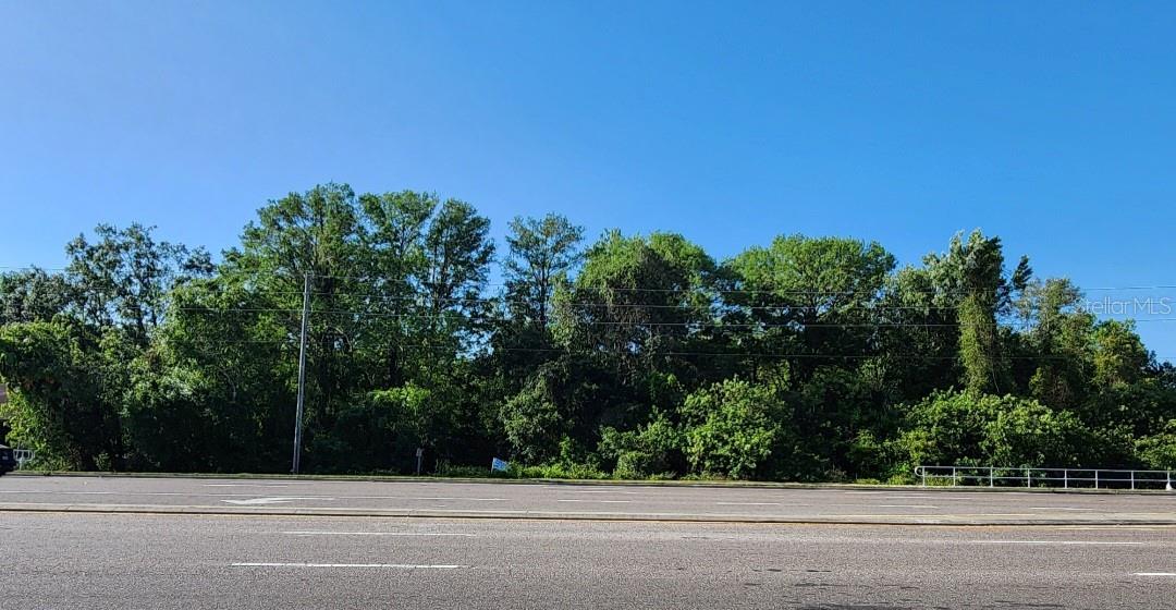 DEVELOPMENT OPPORTUNITY! SURVEYS AVAILABLE, 1.55 ACRES ON SR 54! Bring your vision to life with this rare chance to own three adjoining, SURVEYRD LOTS—totaling 1.55 acres of high-visibility land in a booming New Port Richey corridor. Featuring a combined 250 feet of direct frontage along SR 54, where over 40,000 vehicles pass by daily, this property offers unbeatable exposure for your next commercial venture.  Three Combined Parcels: – 0.85 acres (37,022 SqFt) zoned C1-PID (Commercial). – 0.56 acres (24,181 SqFt) zoned R1MH/SFR. – 0.14 acres (6,141 SqFt) zoned R1MH/SFR.  Strategic Location with flanked by All Pets Hospital to the east and an AC repair shop to the west, with Pasco Square shopping plaza (Bealls Outlet, UPS, Dollar General, Subway, Arby’s, Pizza Hut, and more) just steps away. Easy Access, Riverrun Rd to the south; all major amenities within 2 miles—including hospital, Walmart, restaurants, and pharmacies. Only 30 minutes to Tampa International Airport. Zoning allows flexible options for commercial, mixed-use, or residential development. SURVEY available for all parcels. This is a golden opportunity for entrepreneurs, investors, or builders—whether you’re planning retail, medical, office, or something unique. With unbeatable frontage, high daily traffic, and convenience to everything, this land is ready for your business to shine.