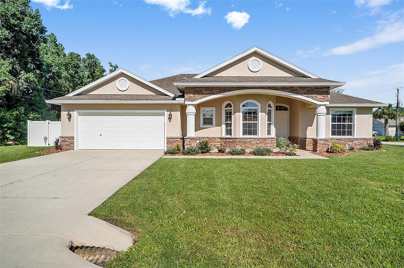 Welcome to paradise in the Matanzas Woods Subdivision– where quality craftsmanship, thoughtful upgrades, and pride of ownership come together! Situated on an oversized corner homesite in the heart of Palm Coast with no HOA, this upgraded Sabal Model from Seagate Homes concrete block 4-bedroom, 2-bath pool home offers the perfect blend of comfort, style, and functionality.
From the moment you arrive, you'll appreciate the beautifully landscaped yard, elegant slate stone front elevation, and exceptional curb appeal. The fully fenced backyard is designed for both relaxation and entertaining, featuring a screened pool enclosure, paver deck, and spacious covered lanai complete with two ceiling fans. French drains throughout the property, a freshly cleaned exterior, and meticulously maintained landscaping reflect the care this home has received from its one and only owner.
Inside, the spacious split-bedroom floor plan offers privacy and flexibility for families, guests, or working from home. The heart of the home is the oversized eat-in kitchen, showcasing granite countertops, stainless steel appliances, tile backsplash, breakfast bar, skylight, 43-inch upper cabinets with crown molding, under-cabinet lighting, and abundant storage. Tile flooring flows throughout the main living areas for easy maintenance and timeless appeal.
The primary suite overlooks the sparkling pool and features a generous walk-in closet and private bath with granite countertops and a beautifully tiled walk-in shower extending from floor to ceiling. The guest bathroom also offers granite countertops, floor-to-ceiling tile in the shower, and a skylight that fills the space with natural light.
The oversized garage provides epoxy flooring, abundant storage, and attic access with pull-down stairs for even more storage space. Major updates include a new air conditioning system and water heater, both replaced in 2024, giving buyers added peace of mind.
Conveniently located near shopping, restaurants, schools, and 14 miles to the beach, this exceptional home also offers easy access to major highways, making commuting a breeze. If you've been searching for a meticulously maintained pool home that's truly move-in ready, this is the one you won't want to miss!