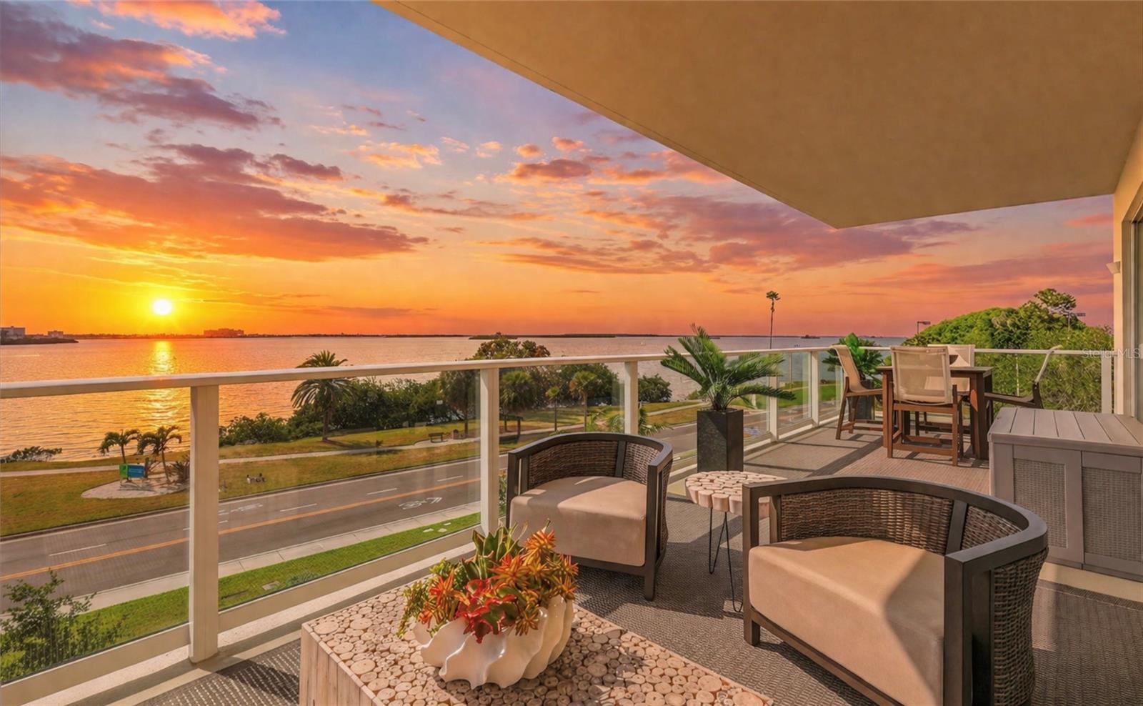 Experience elevated coastal living in this luxurious, professionally designed corner residence at Serena by the Sea—one of Clearwater’s most coveted addresses. Built in 2023, this exceptional waterfront community offers modern construction and enhanced storm resilience. This stunning third-floor condominium features 2 bedrooms, a versatile flex retreat ideal for a media lounge, guest space with a pull-out couch, and/or home office, and 2.5 baths, showcasing unobstructed views stretching across the Gulf of Mexico, the Intracoastal Waterway, and the downtown skylines. Offering approximately 2,267 sq. ft. of interior living space and 492 sq. ft. of private terraces, the expansive outdoor areas—with no neighboring balconies—provide unrivaled privacy and spectacular sunset views. The gourmet chef’s kitchen showcases custom Italian cabinetry offering abundant storage, Bianco Venatto stone countertops with a waterfall-edge island, a reverse osmosis system, and premium Gaggenau appliances, including a gas cooktop, built-in combi-microwave convection oven, wall oven, dishwasher, and an oversized built-in refrigerator seamlessly integrated with matching cabinetry, along with a Bosch vent hood and a Thermador beverage refrigerator. Both bedrooms feature en-suite spa-inspired baths and premium built-in walk-in closets. The primary suite includes a private terrace, while the second bedroom offers sliding glass doors with direct access to the main terrace off the living room. Additional highlights include motorized solar shades throughout, blackout drapes in the bedrooms, two dual-zone HVAC systems, smart home technology, an extra-large Maytag Commercial line washer and dryer, an AtmosAir air purification system, and a private climate-controlled storage unit. Residents enjoy over 23,000 sq. ft. of resort-style amenities, including concierge services, a saltwater zero-edge pool, private cabanas, a luxe spa with sauna and cold plunge, a fitness center, fire pit lounges, a clubhouse, and secure access. A private marina is underway with priority slip access offered to residents. Ideally located near Downtown Dunedin, TD Ballpark, Clearwater Beach, Honeymoon Island, the Pinellas Trail, and Downtown Clearwater—home to waterfront concerts at The Sound and performances at the historic Capitol Theatre. Situated in a golf cart-friendly community. Furnishings and décor are negotiable.